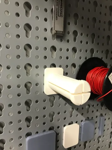 Wire roll holder for key slot pegboard