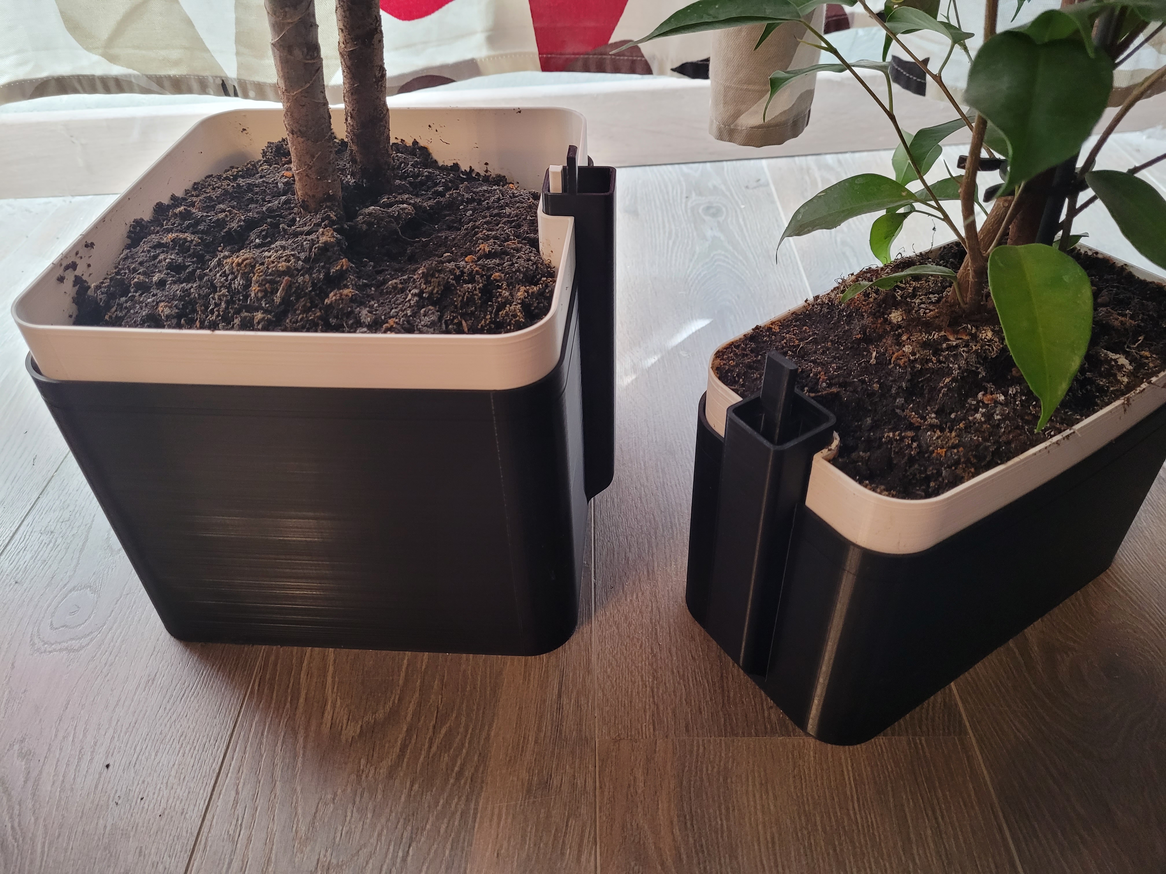 Self-watering scare planter bigger