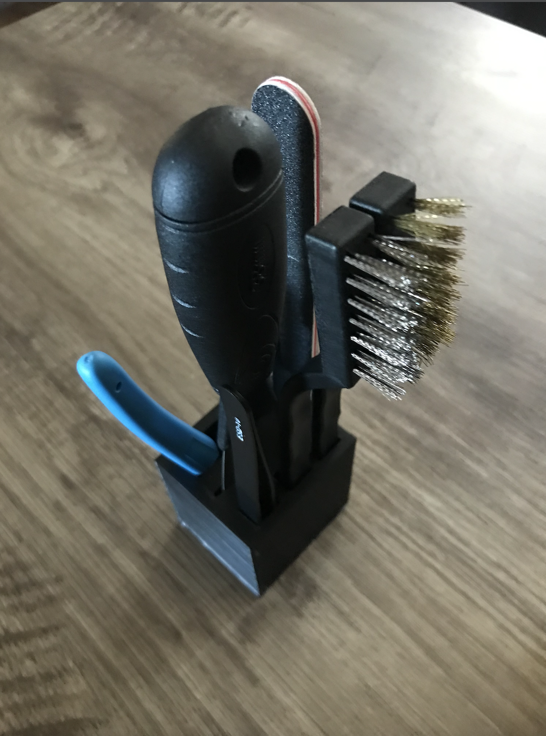 Tool holder for brushes tweezers and filament cutters