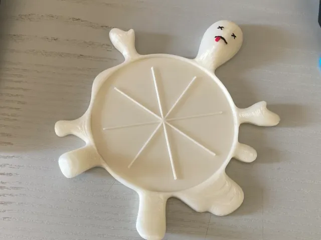 Squished guy coaster.