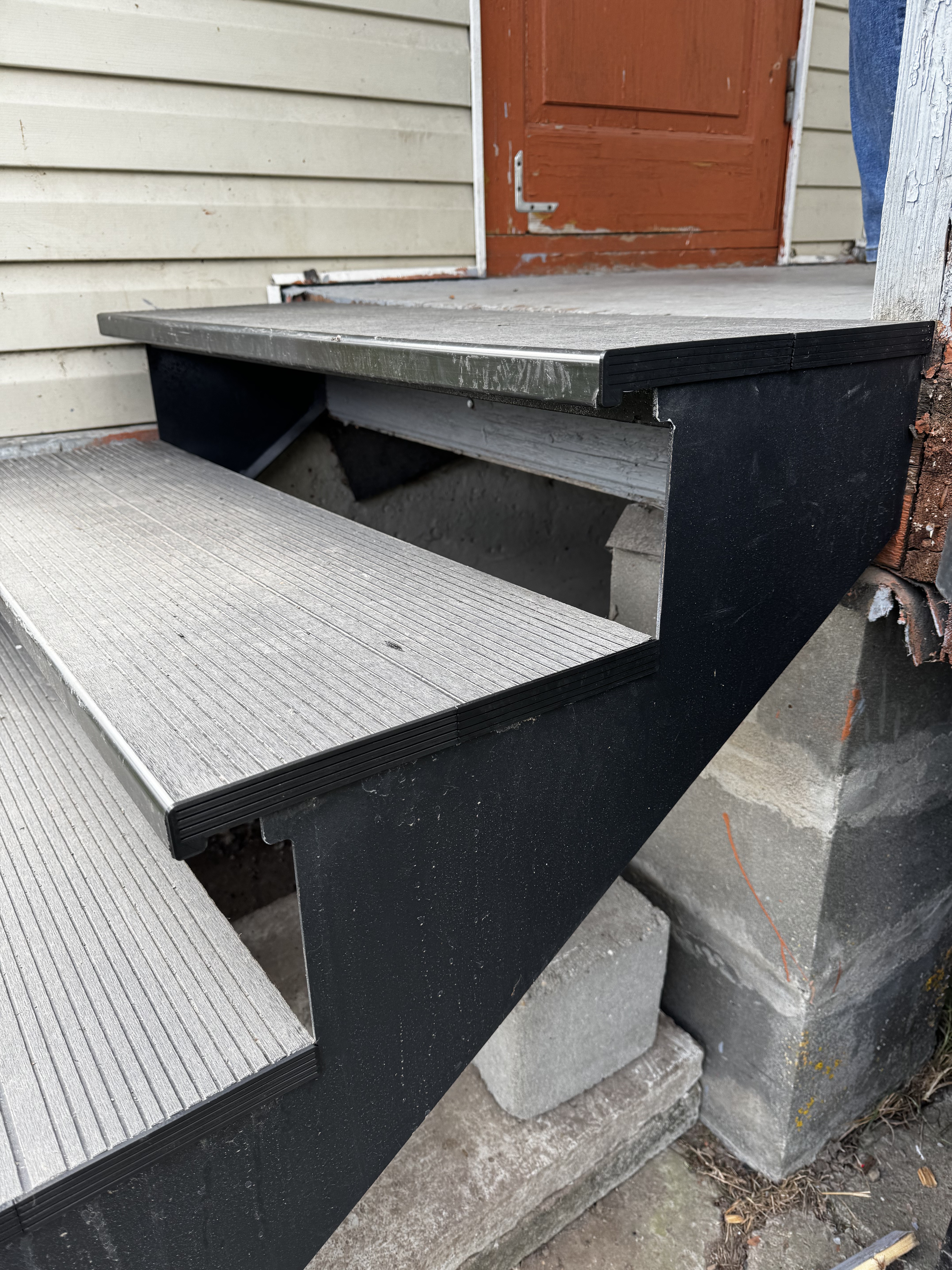End caps for wood-plastic composite (WPC) steps