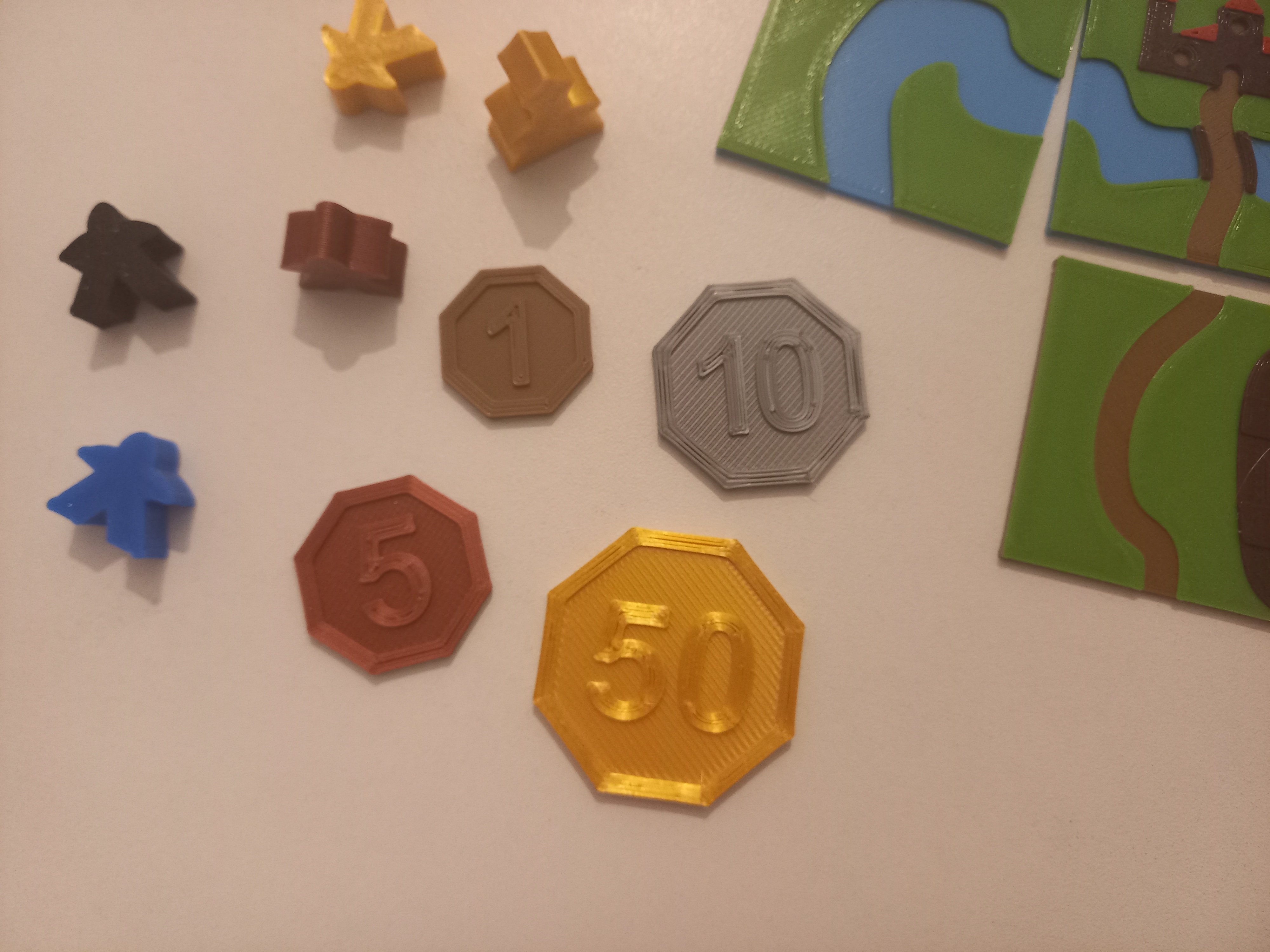 Octogonal coins or tokens - 1, 5, 10, 50