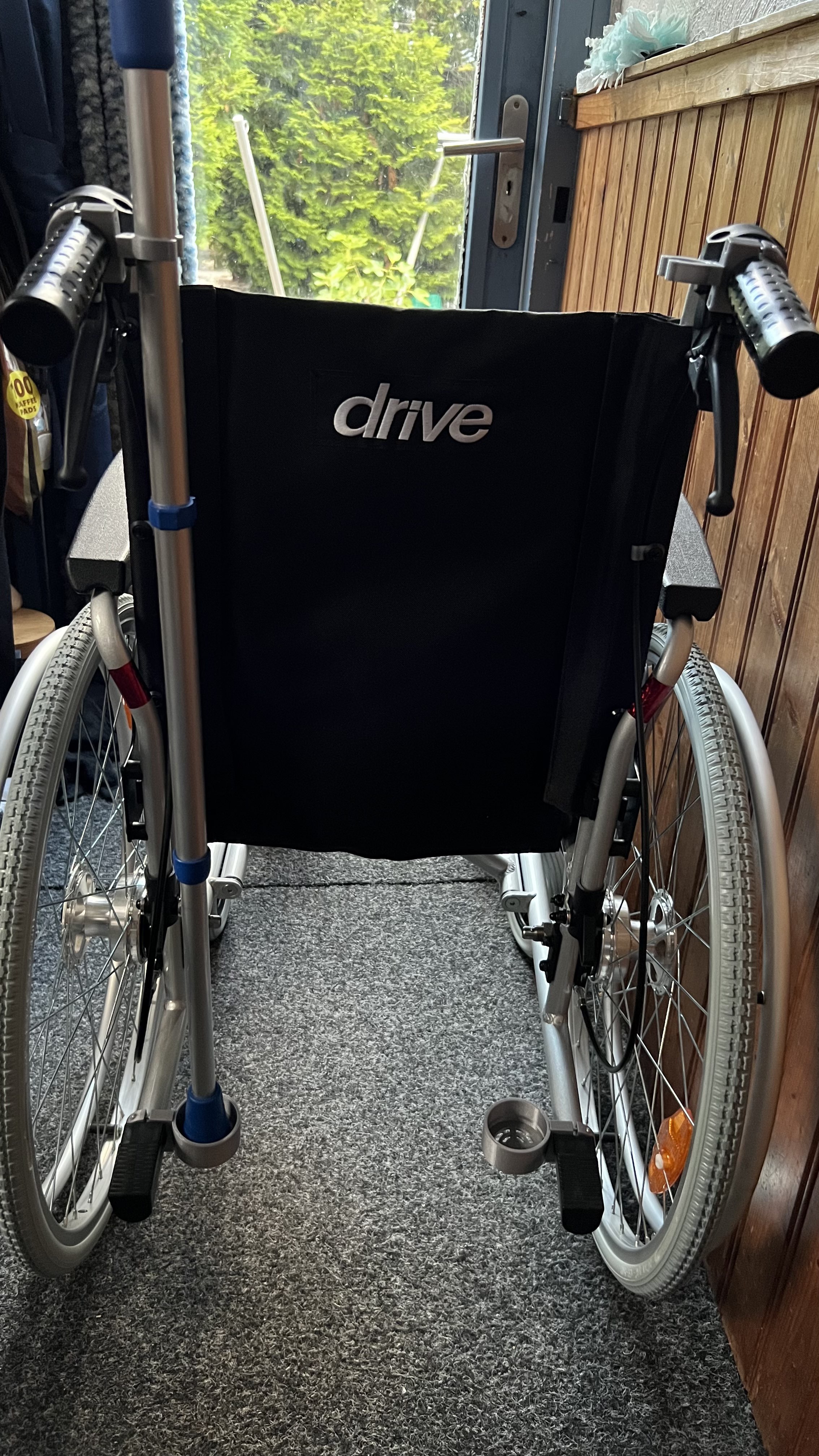 Crutches holder for wheel chair