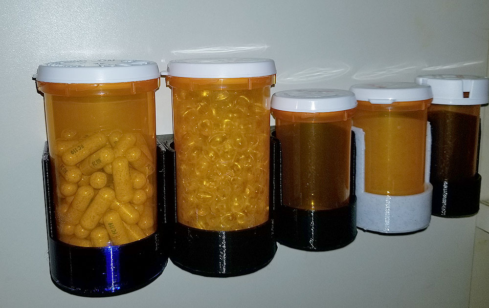 A Pill bottle stand for four Walgreens bottles - one large, two medium and  one small by NotLikeALeafOnTheWind, Download free STL model