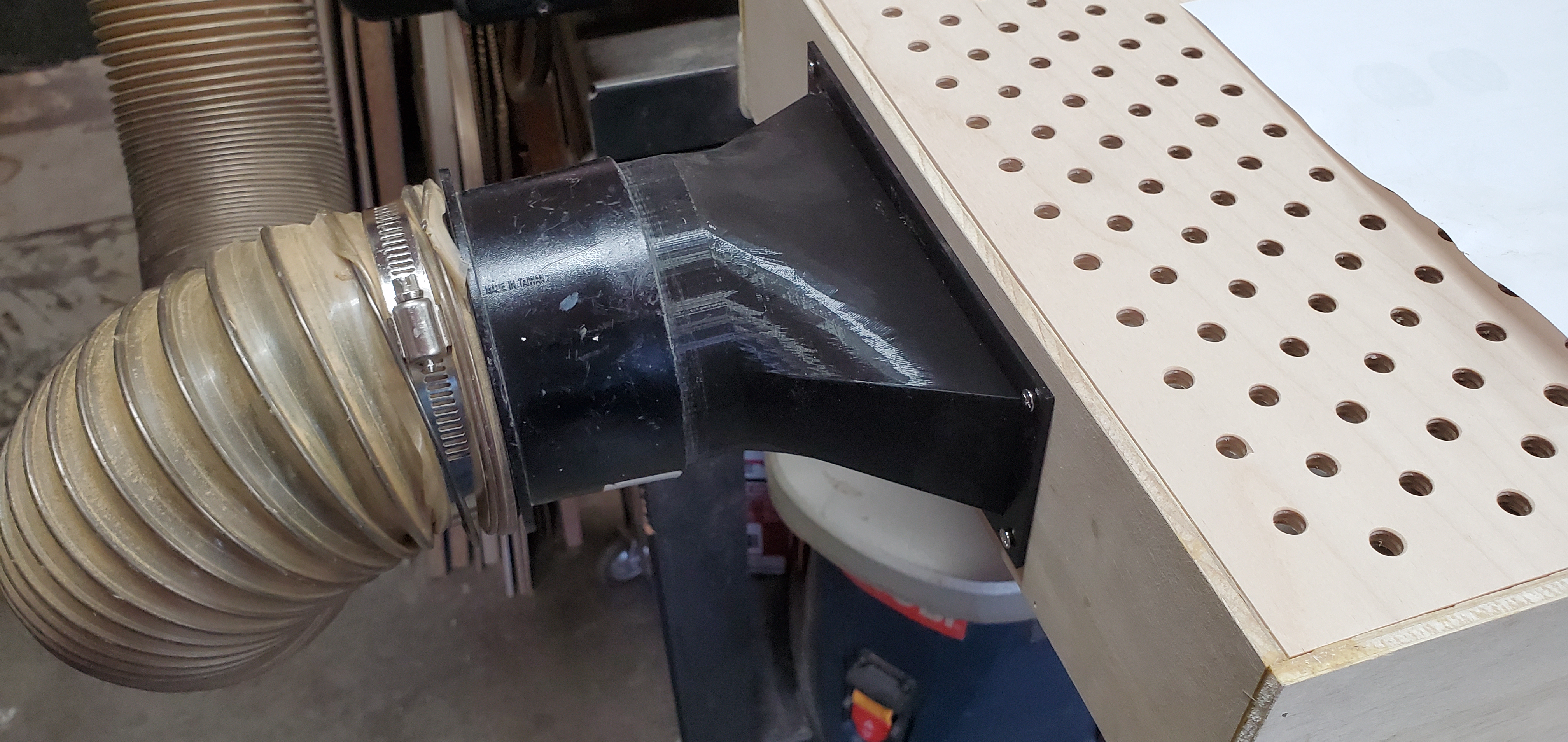 Down draft table dust collector connector
