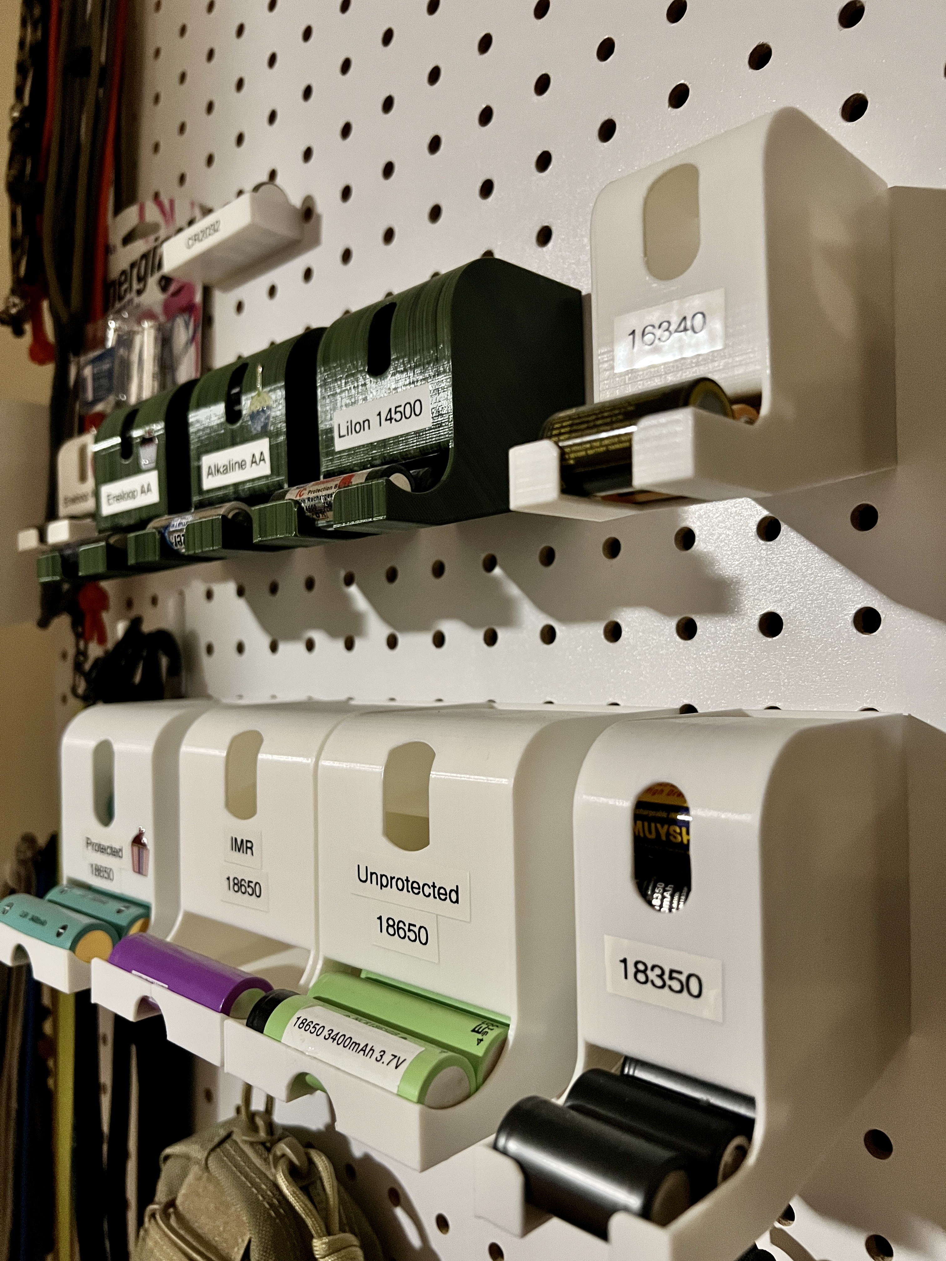 Pegboard battery dispensers