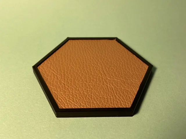 Coaster with leather inlay