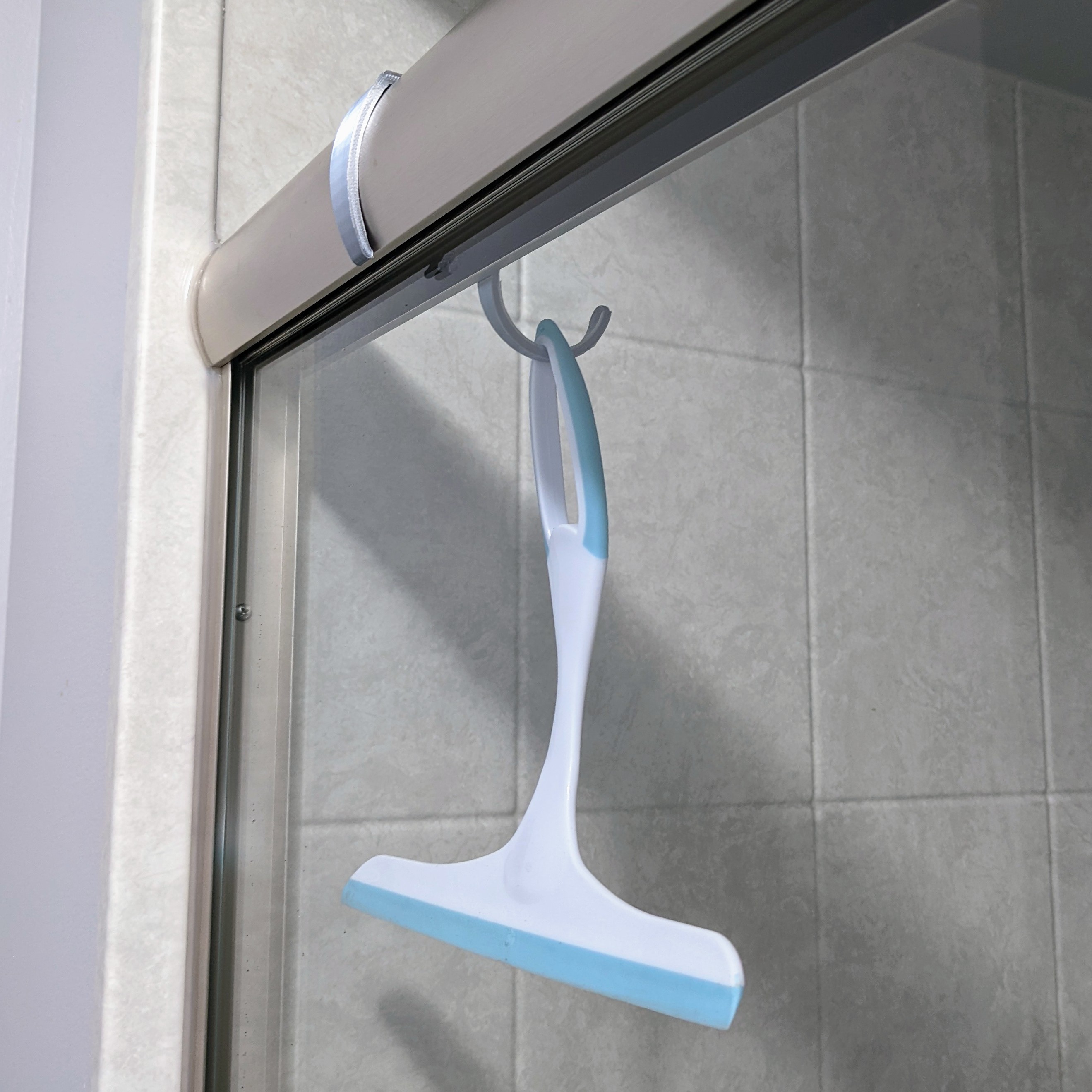 Shower squeegee / scraper hook