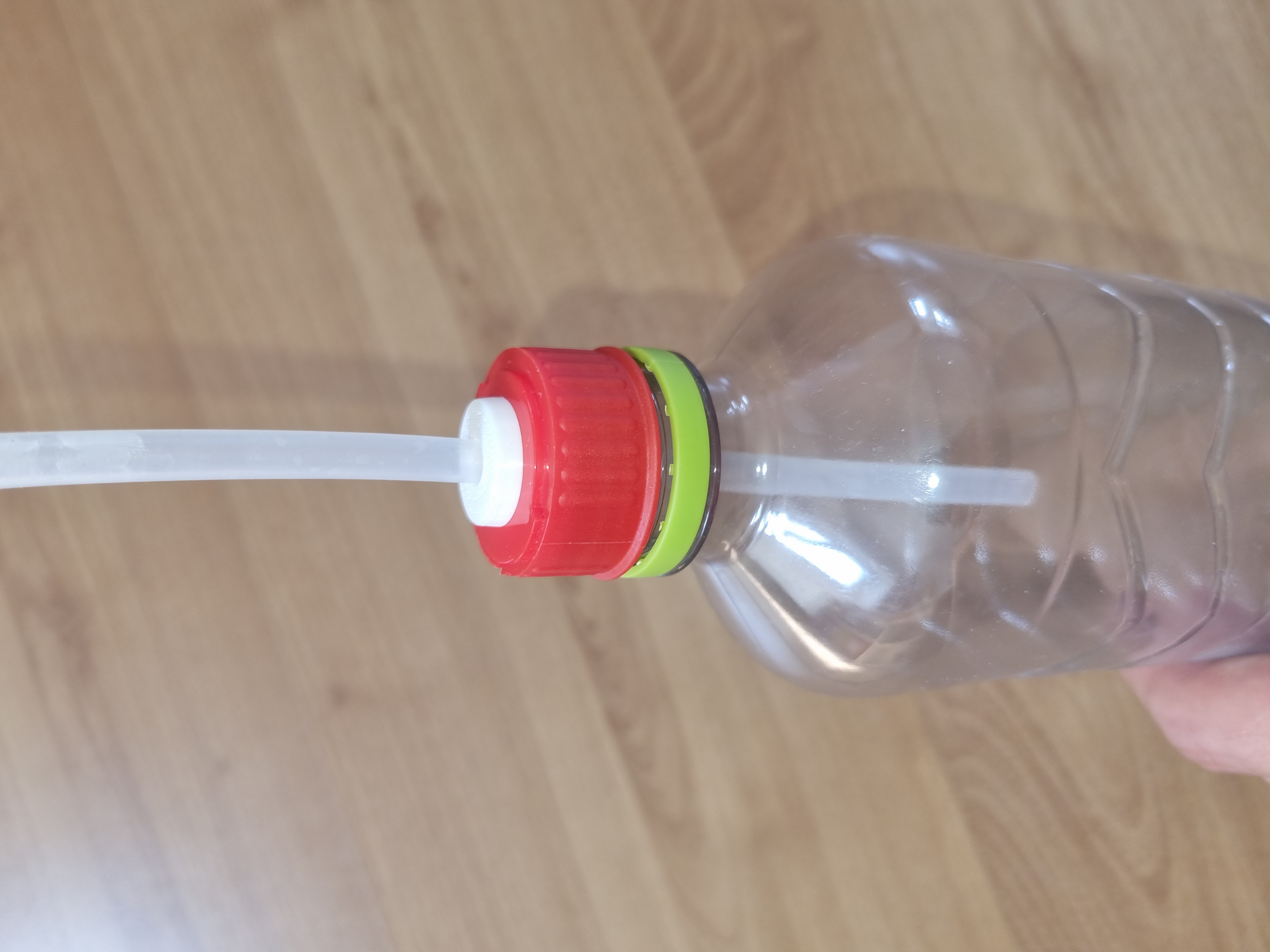 Tube adapter for plastic bottle cap