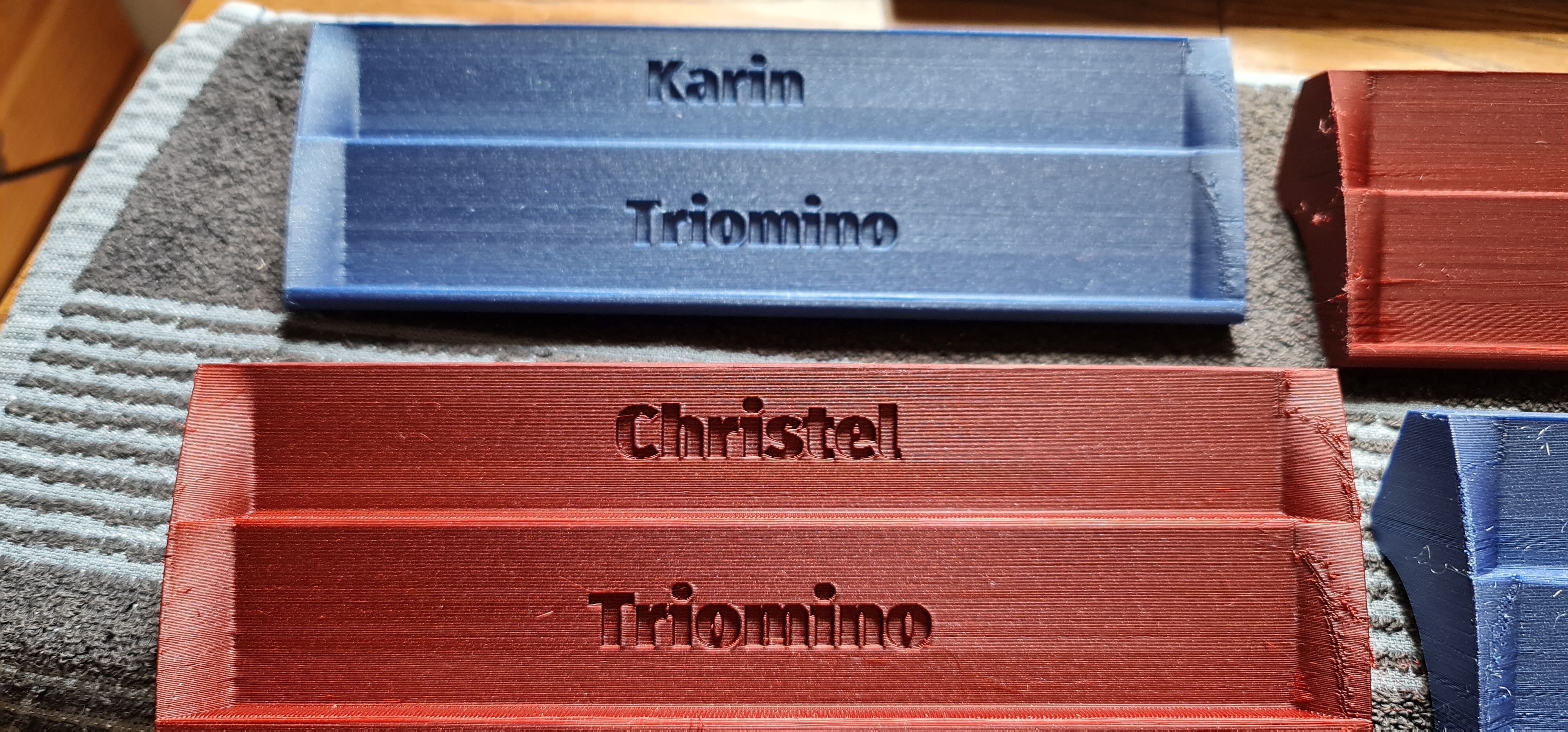 Triomino rack with and without names/logo on it