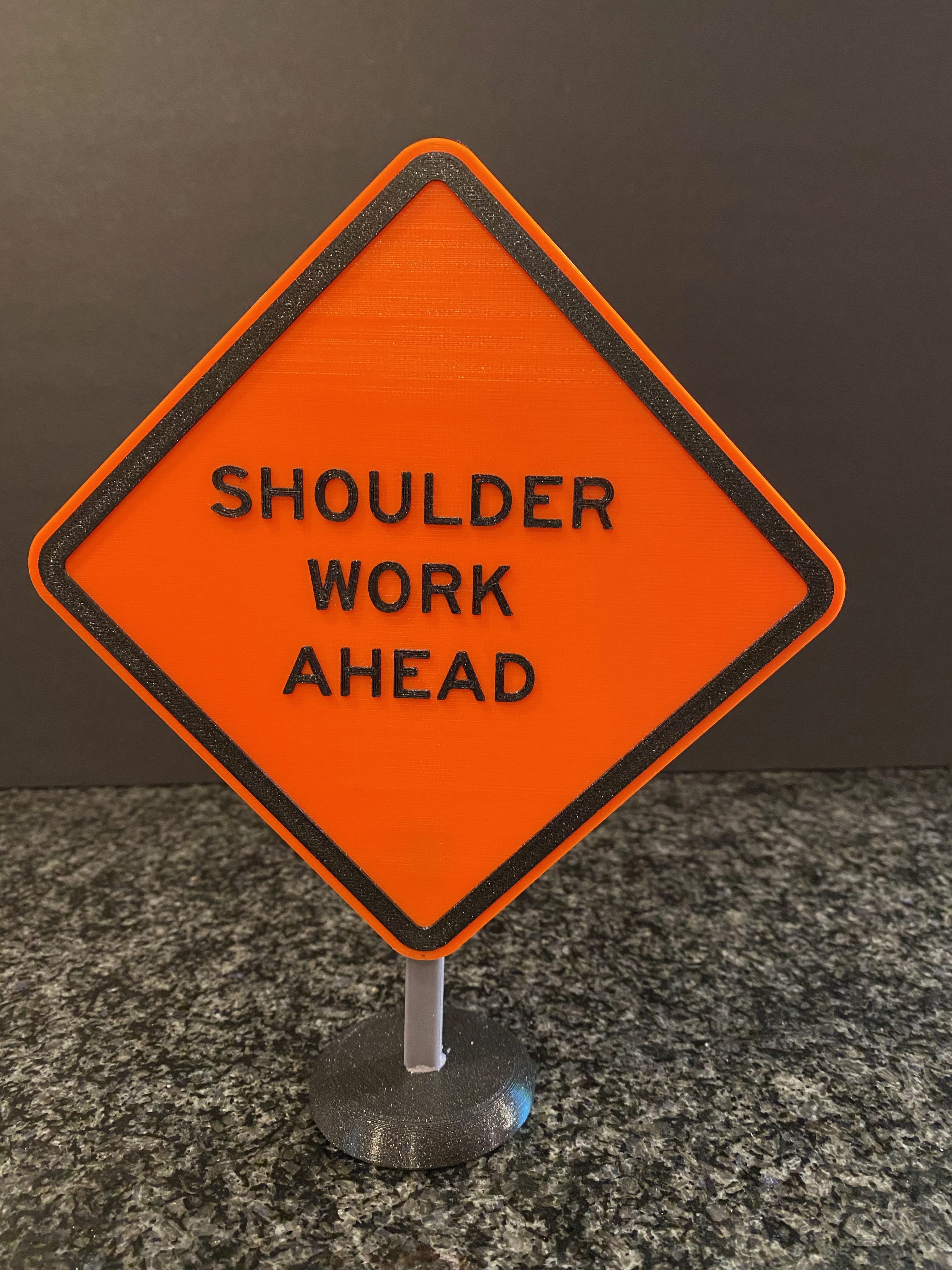 Shoulder Work Road Sign