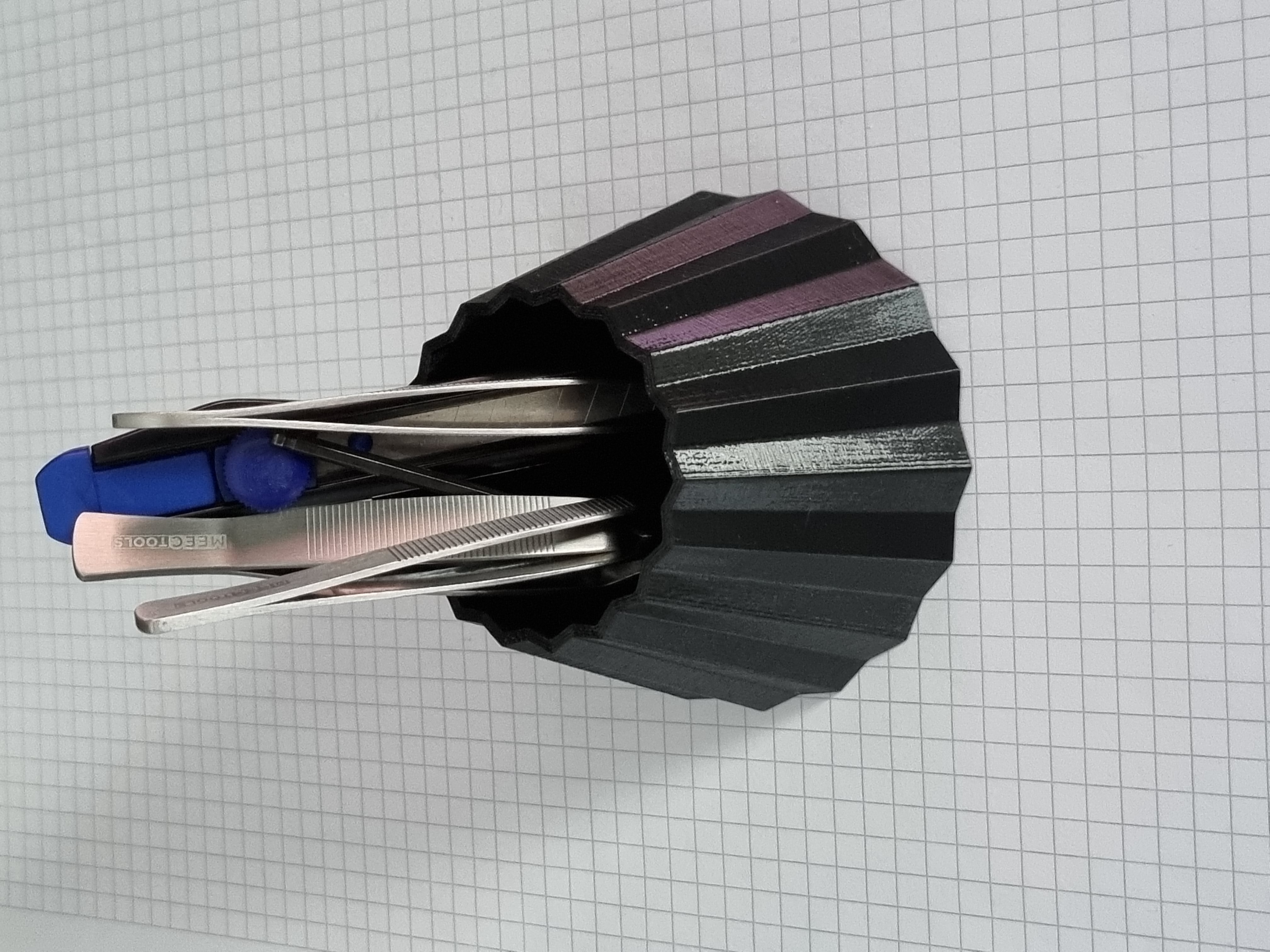 Barnacle like pen/tool holder