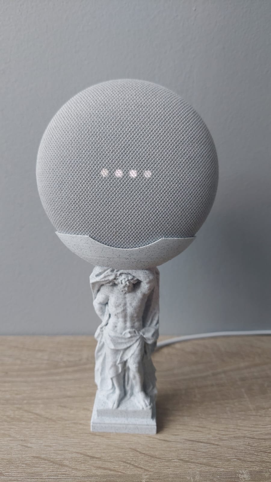 Atlas holding a Google Mini