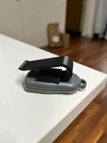 Sun visor clip for any garage remote control