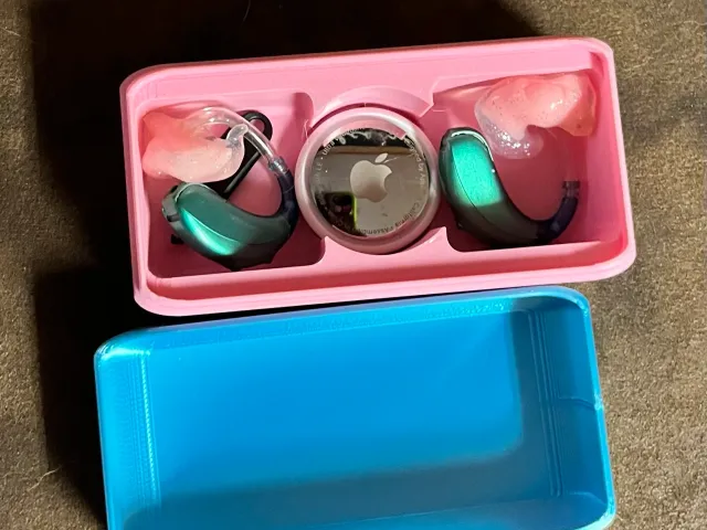 hearing aid case with airtag