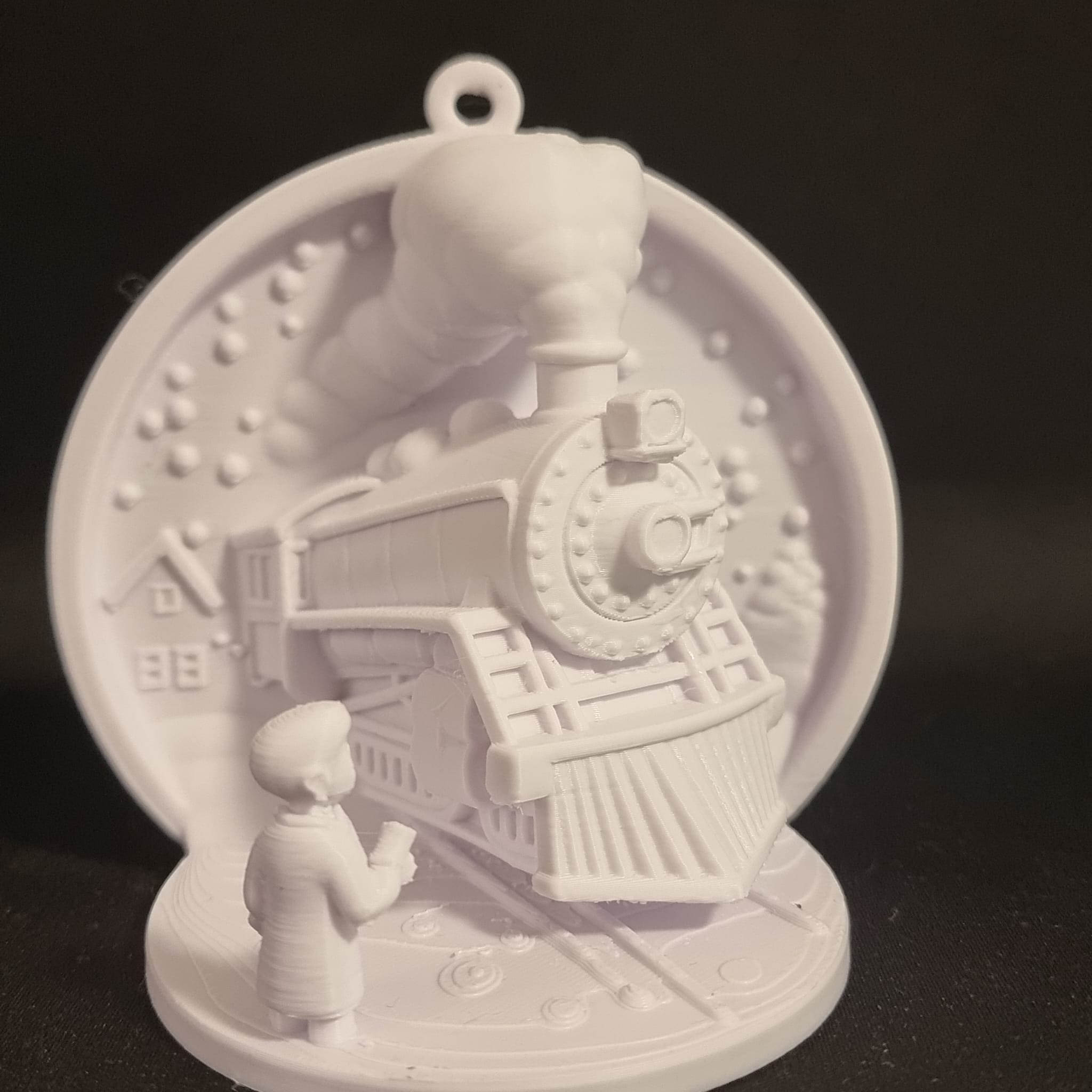 key moment from the beloved movie, The Polar Express Ornament
