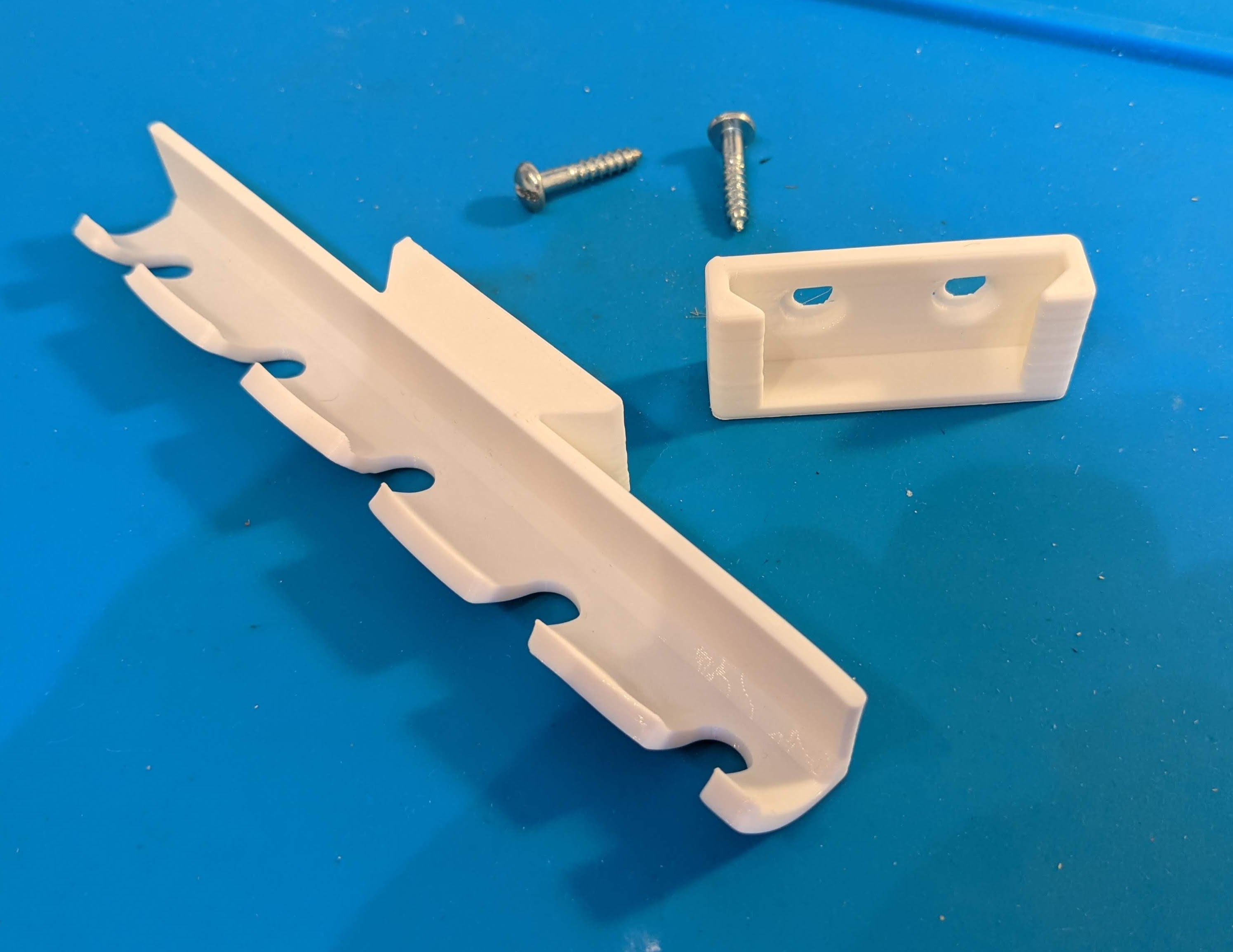 Holder for removable toothbrushholder with screws