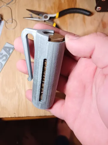 Spring-loaded Quarter Holder