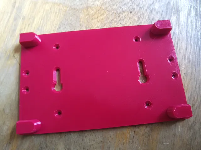 Linksys WRT54GL wall mounting bracket.