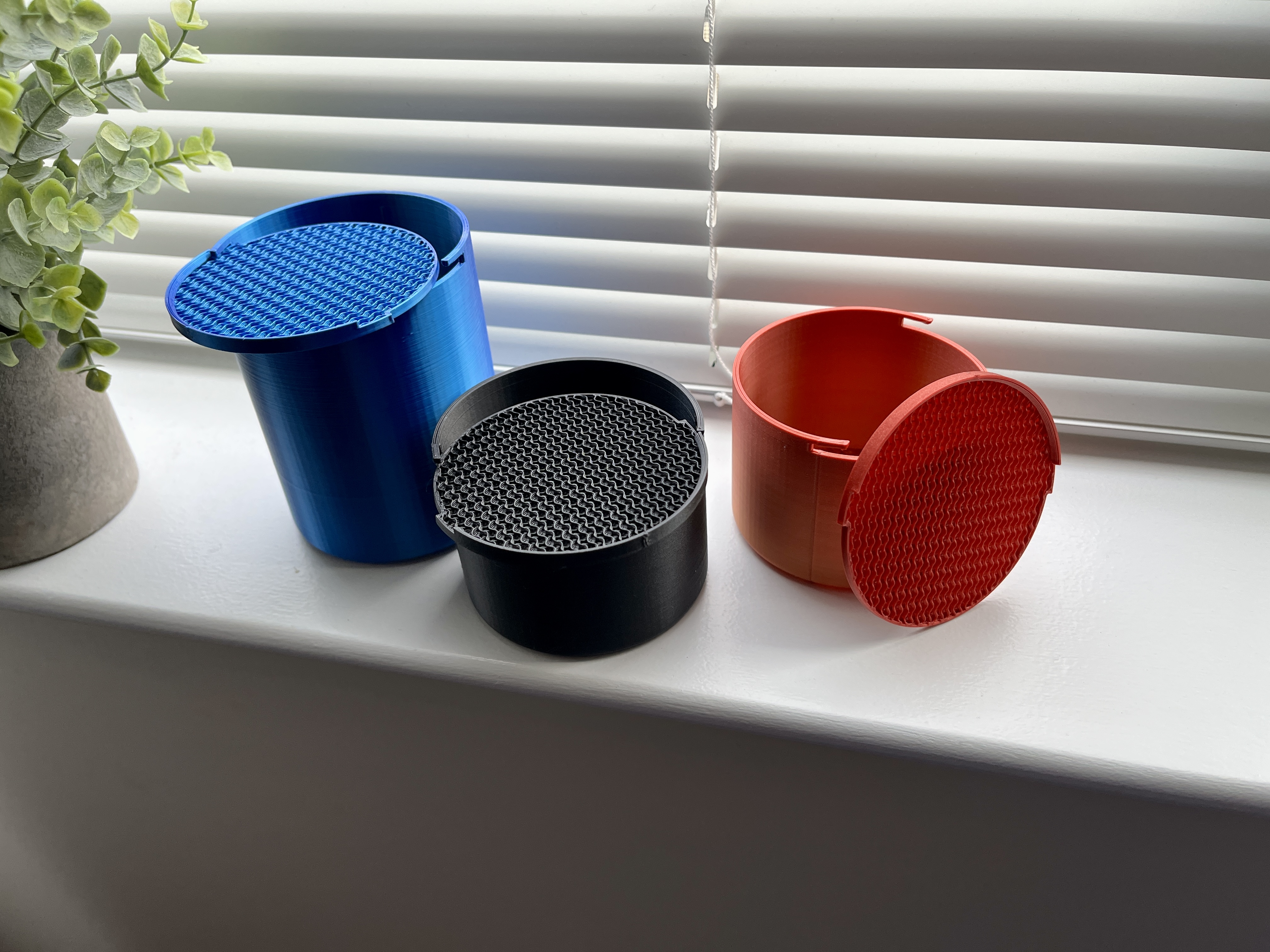 Cylindrical container with swappable lids