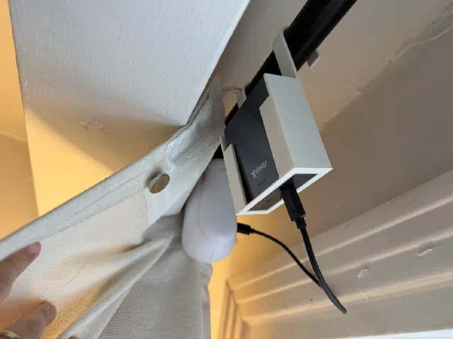 Powerbank holder for charging rod curtain robot