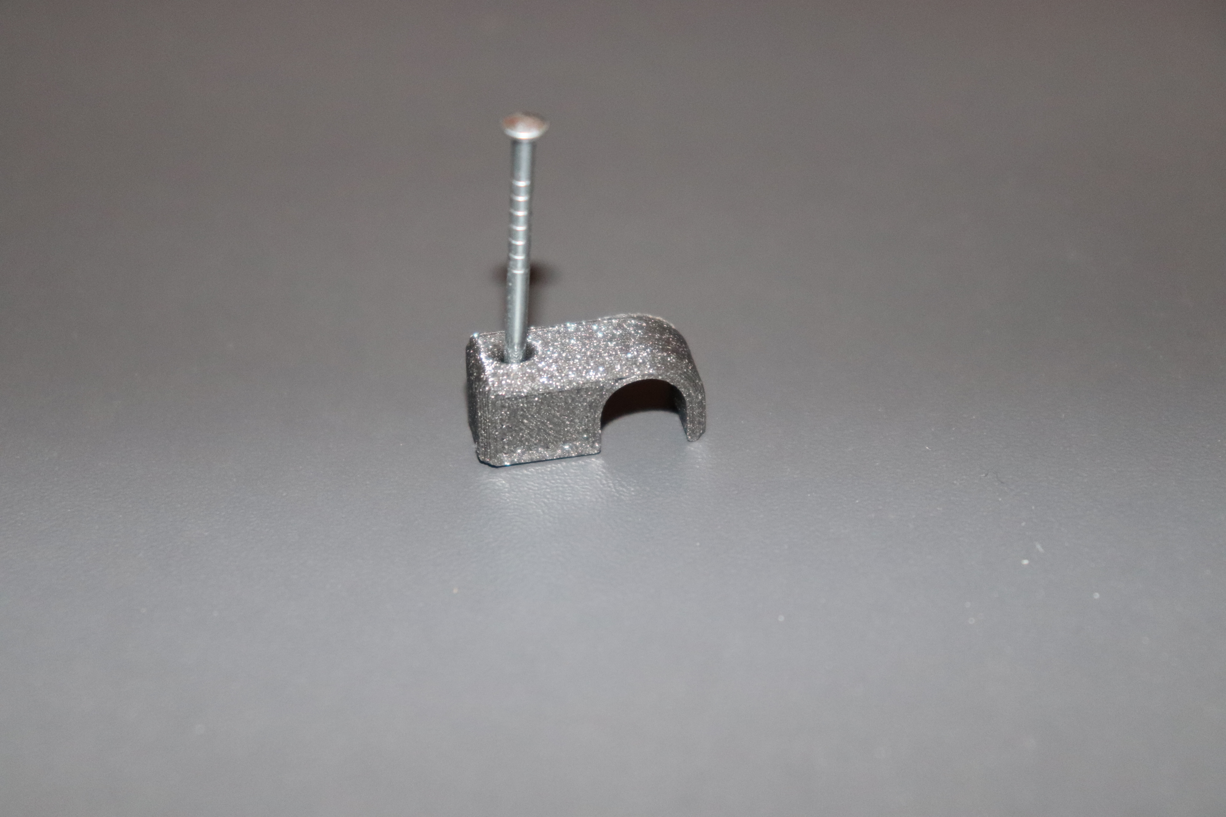 Wall cable clamp