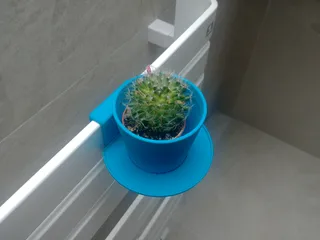 Flower pot with a saucer and a holder