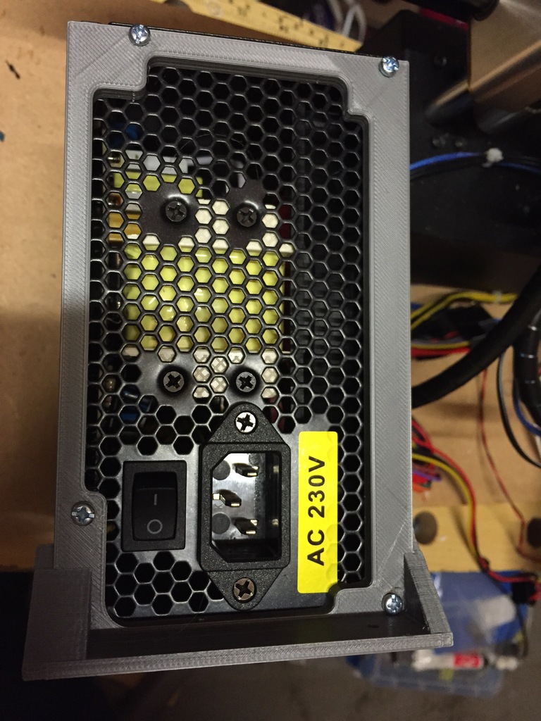 ATX power supply cutout, screw down mounting bracket
