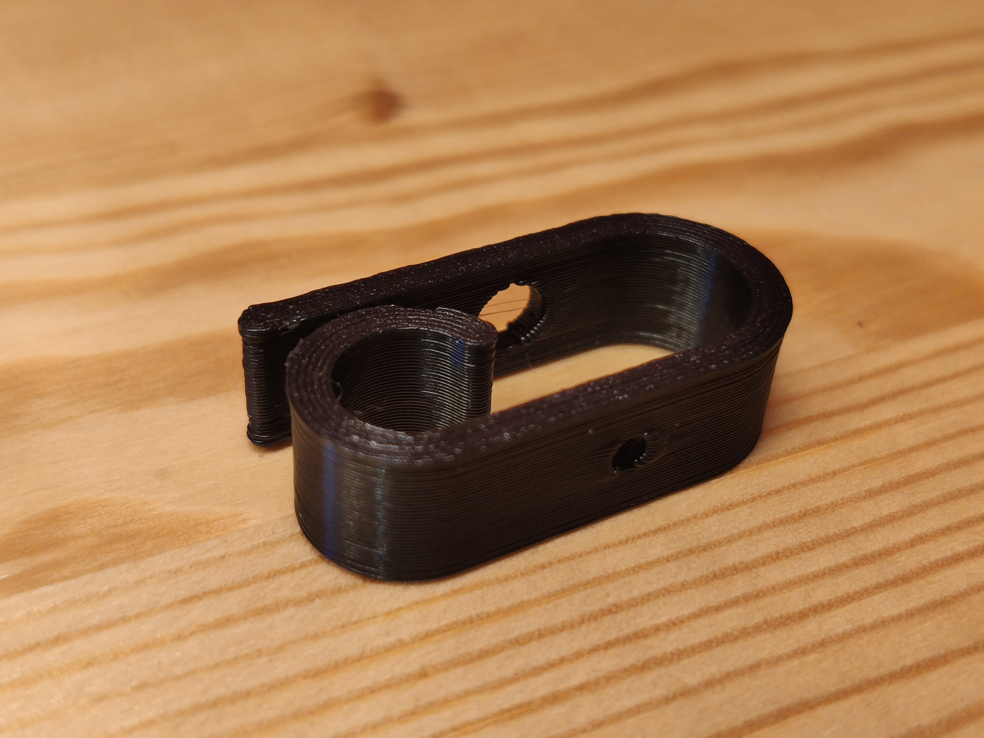 Cable clip with a screw hole