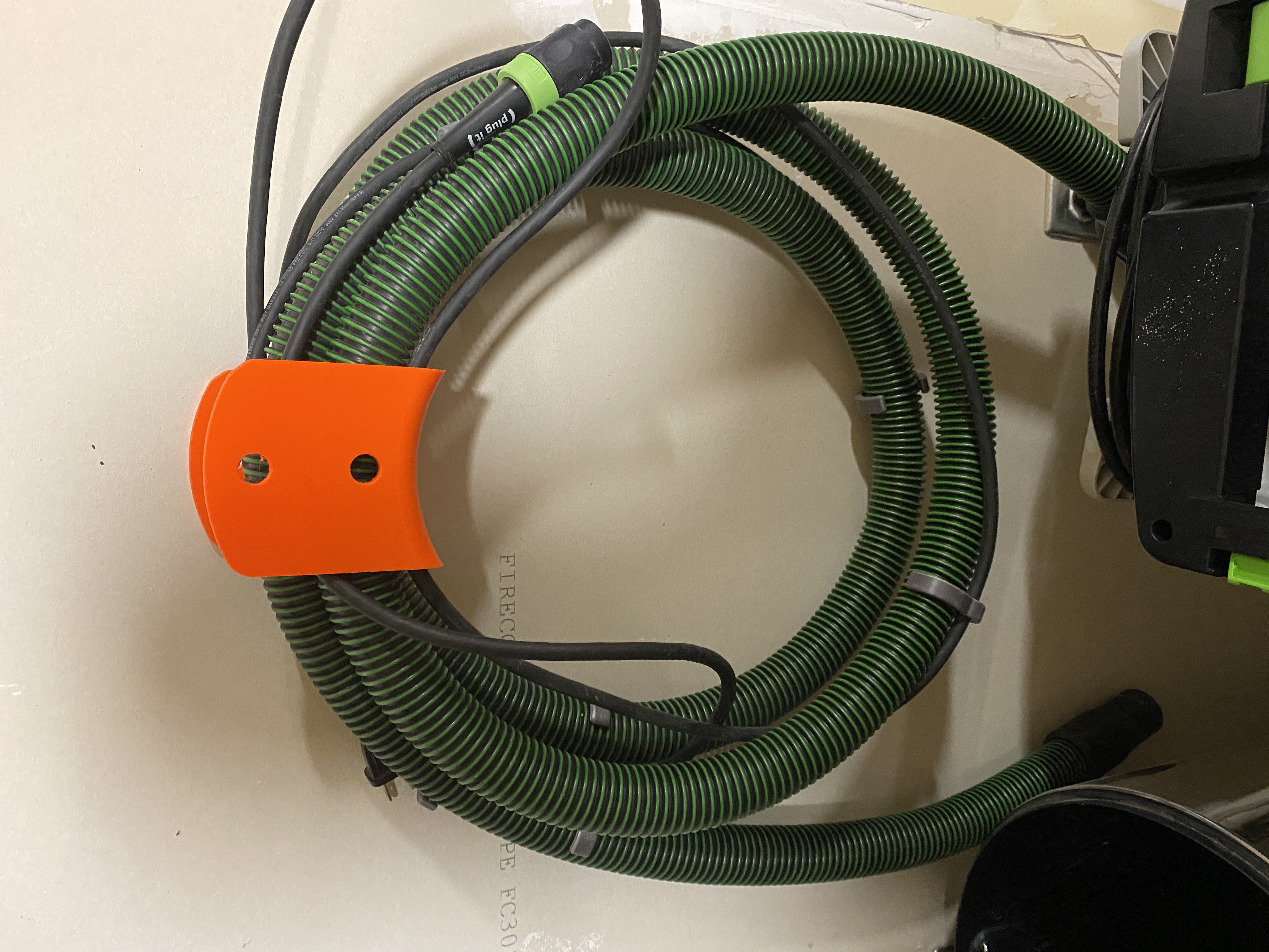 Hose and cable holder wall dog screw adaptation