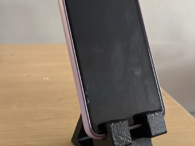 Compact phone holder with cable guide