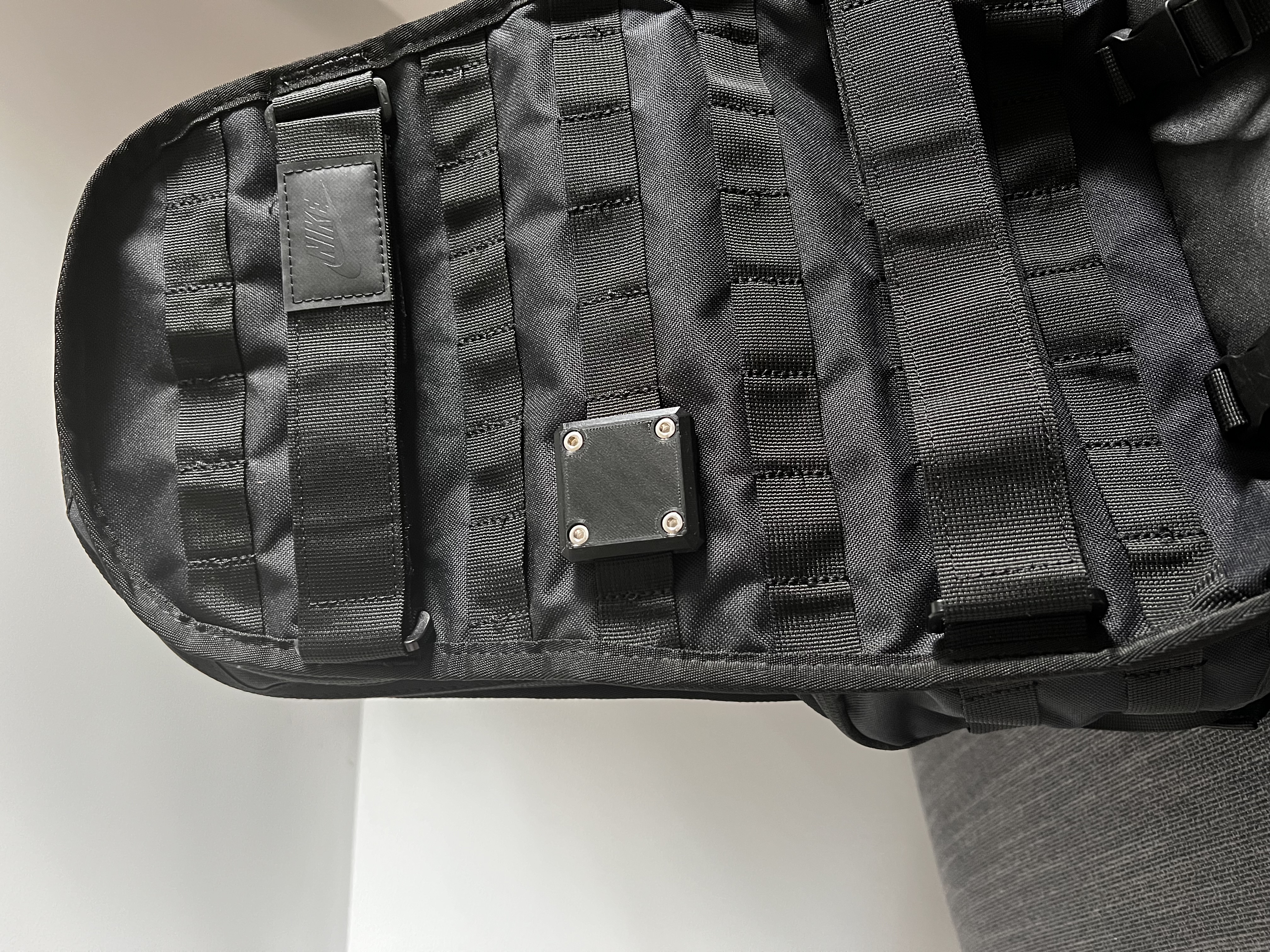 Rugged AirTag backpack mount
