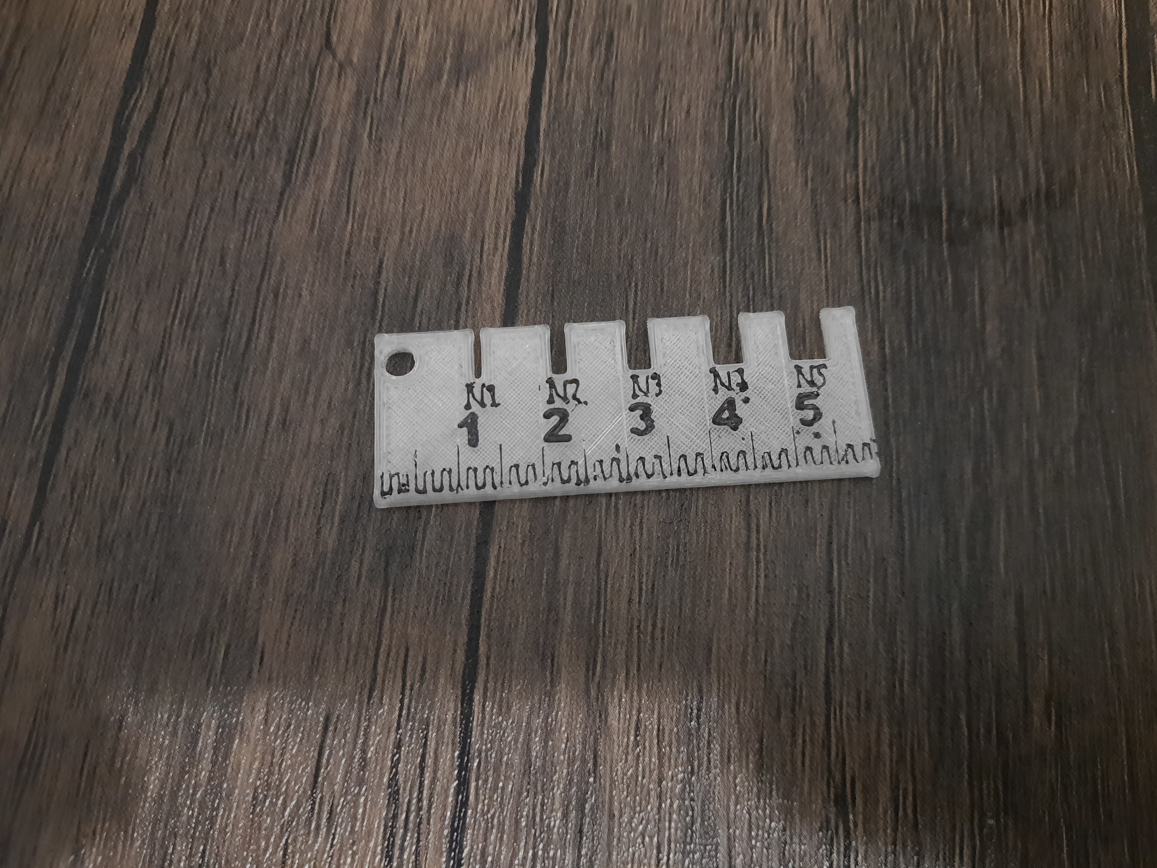 Keychain ruler and screw measuring