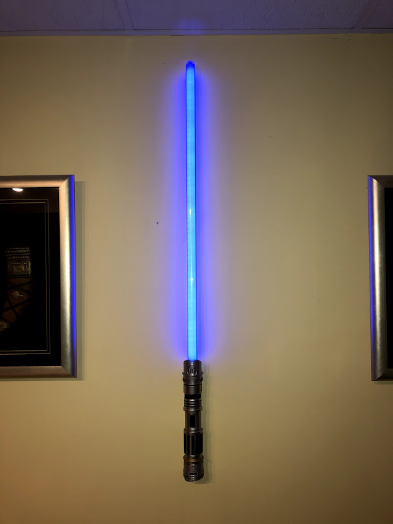Hidden Savi's lightsaber wall mount for specific peace and justice hilt