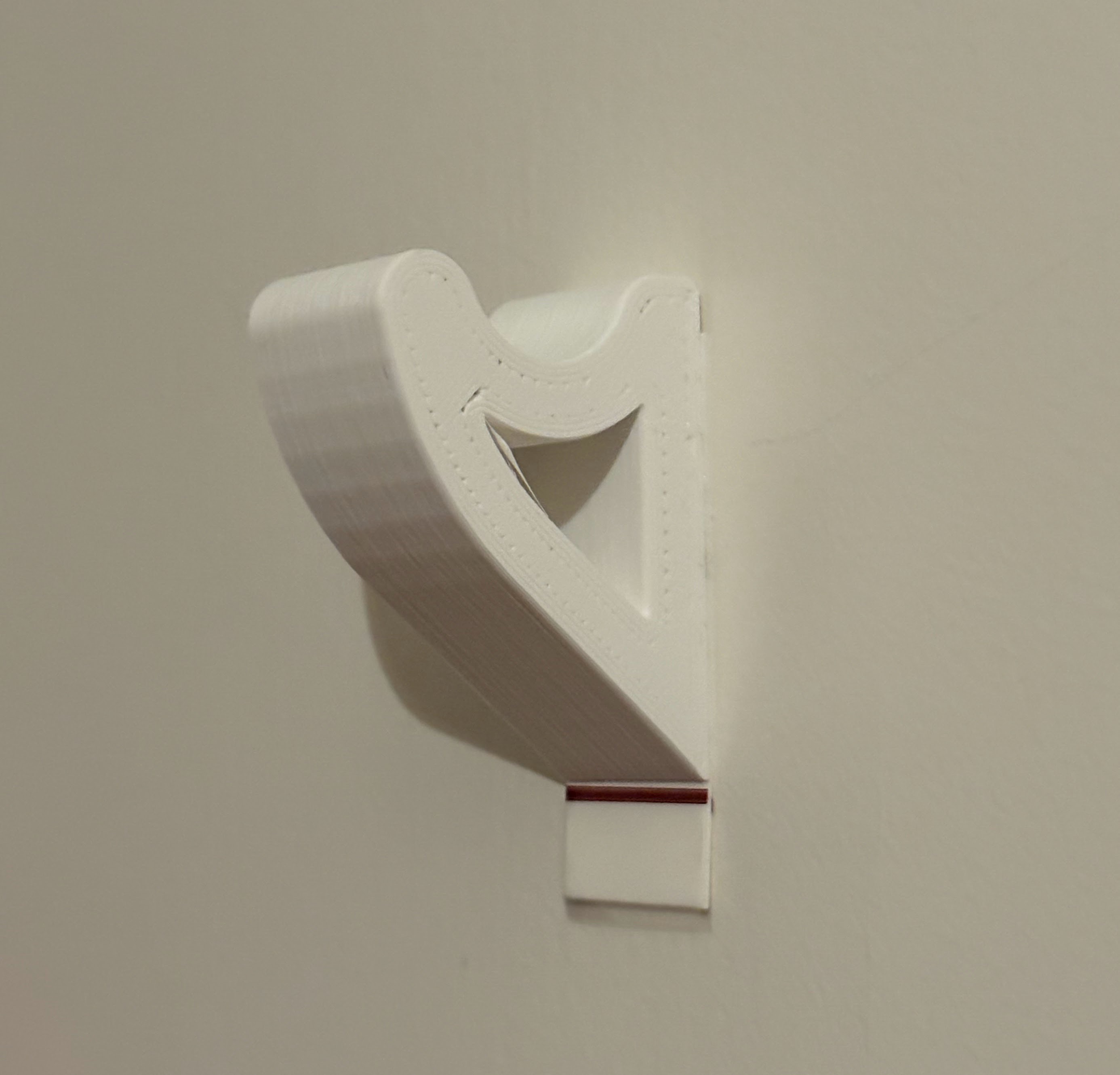 Simple Hook. Strong, use with Tesa Powerstrip.