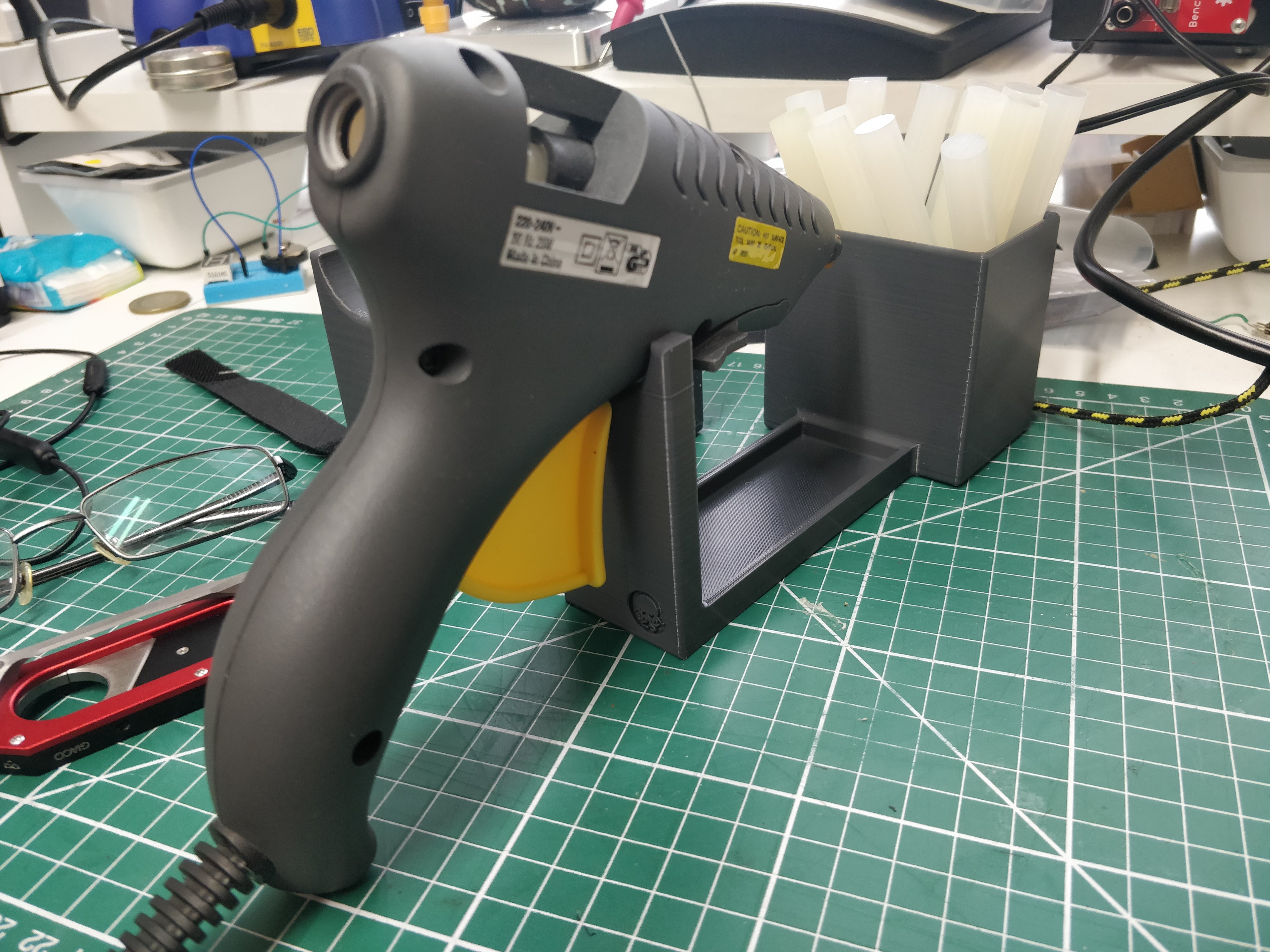 Glue gun stand with stick holder