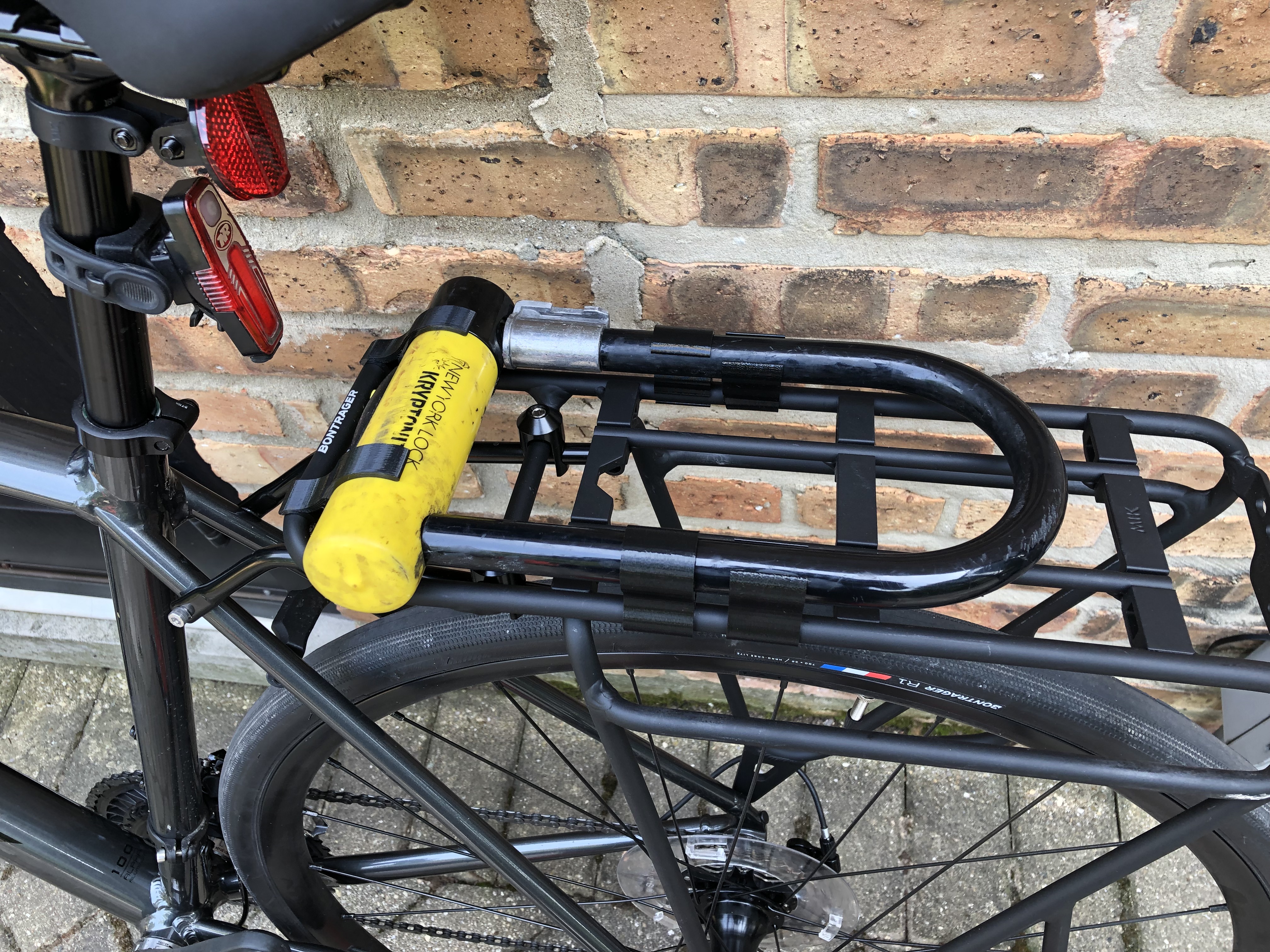 Parameterized U-lock holder for rear bike rack (Bontrager MIK Deluxe rack and Kryptonite New York lock)