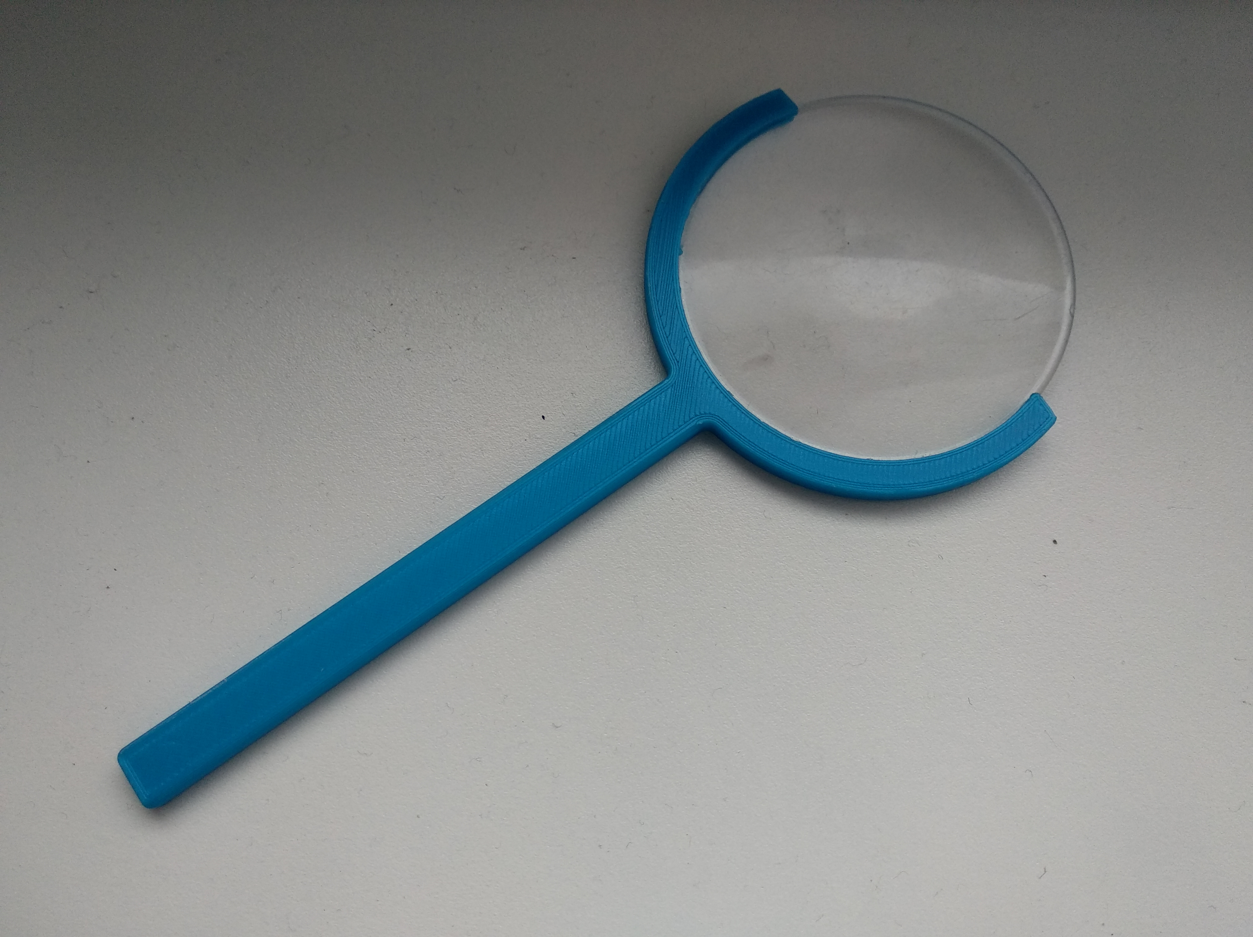 Magnifying glass holder