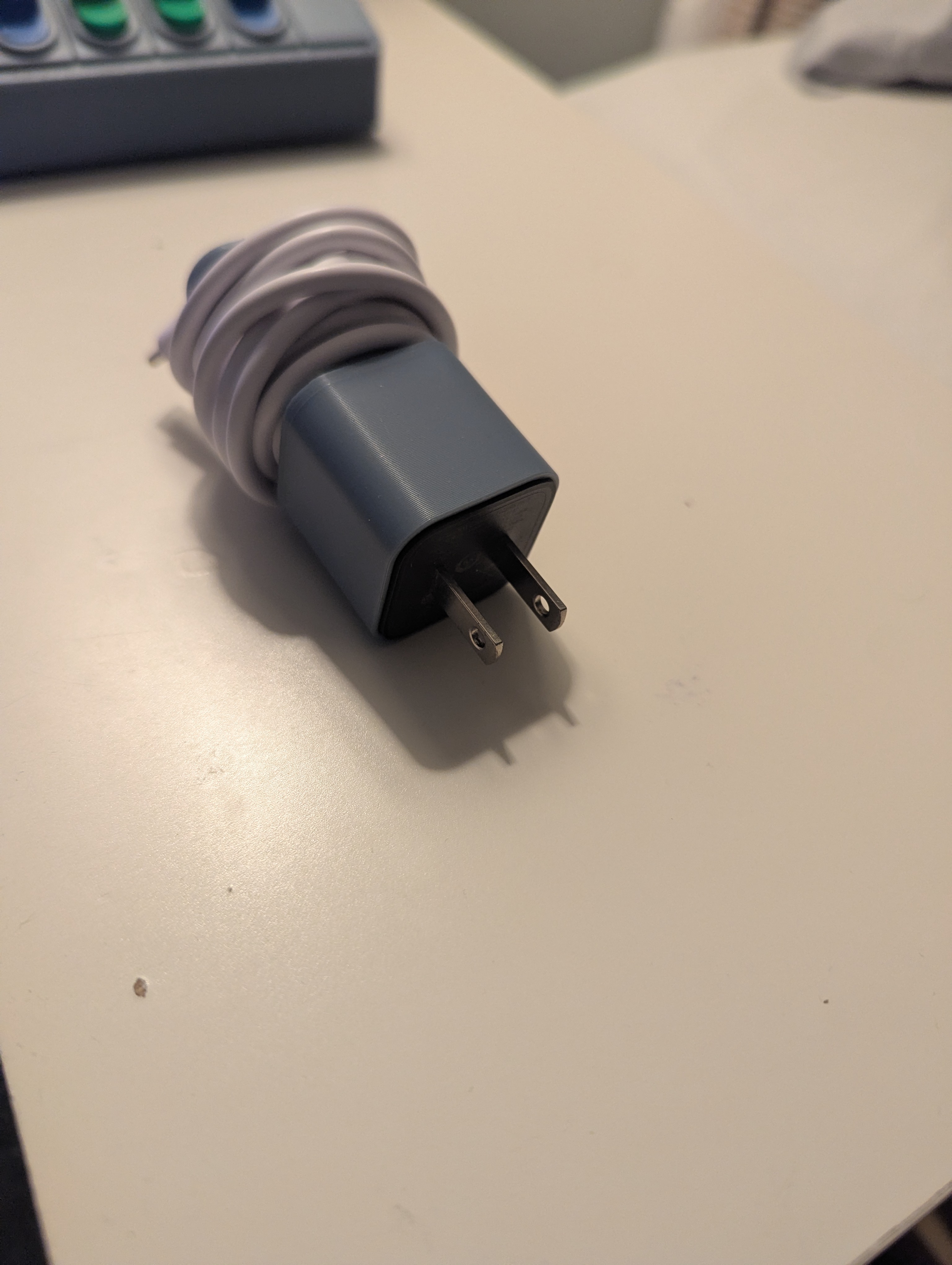 Charging brick and cable holder