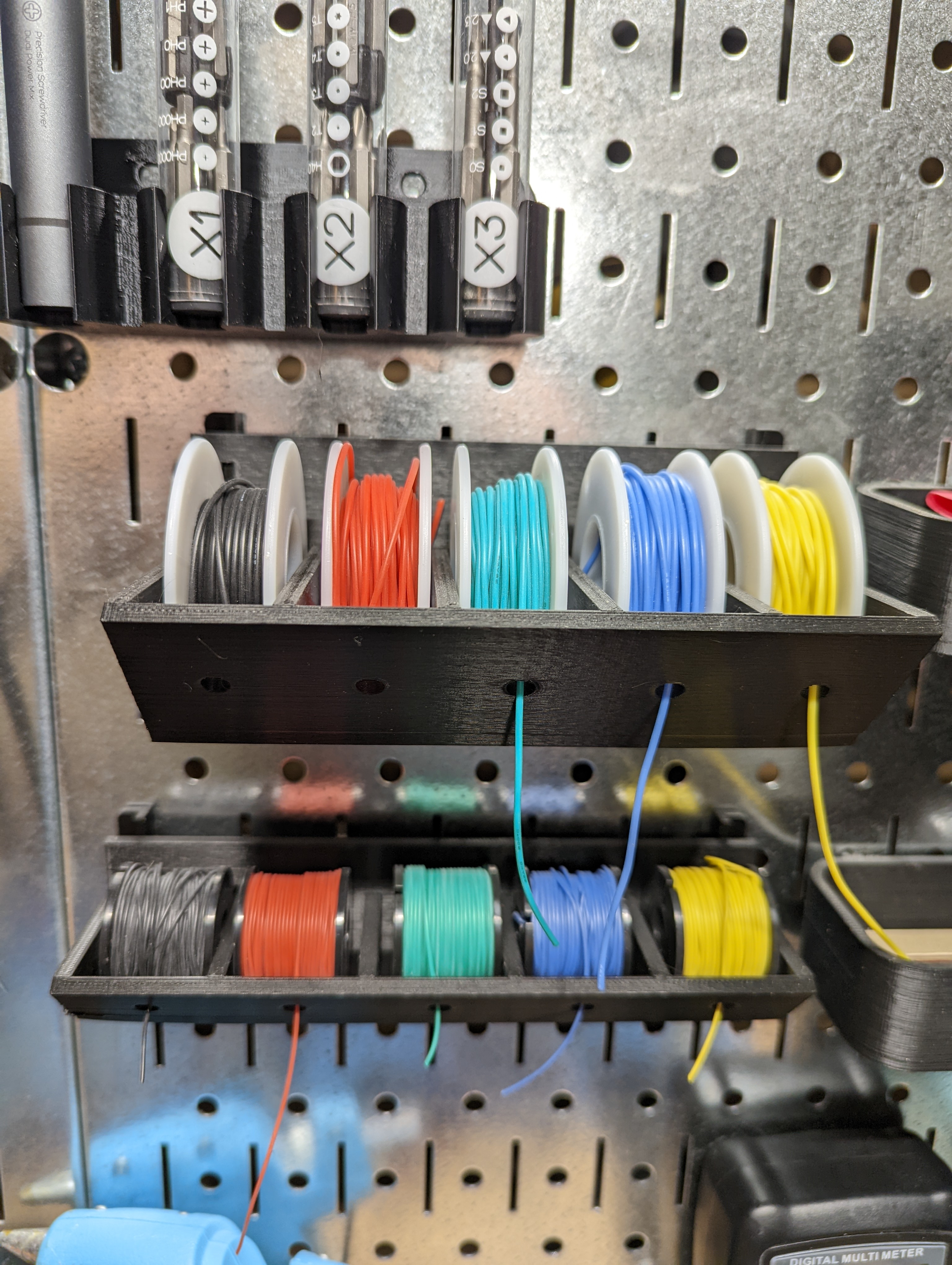 Pegboard mounted wire spool holder for Striveday™ 20 AWG wire kit.