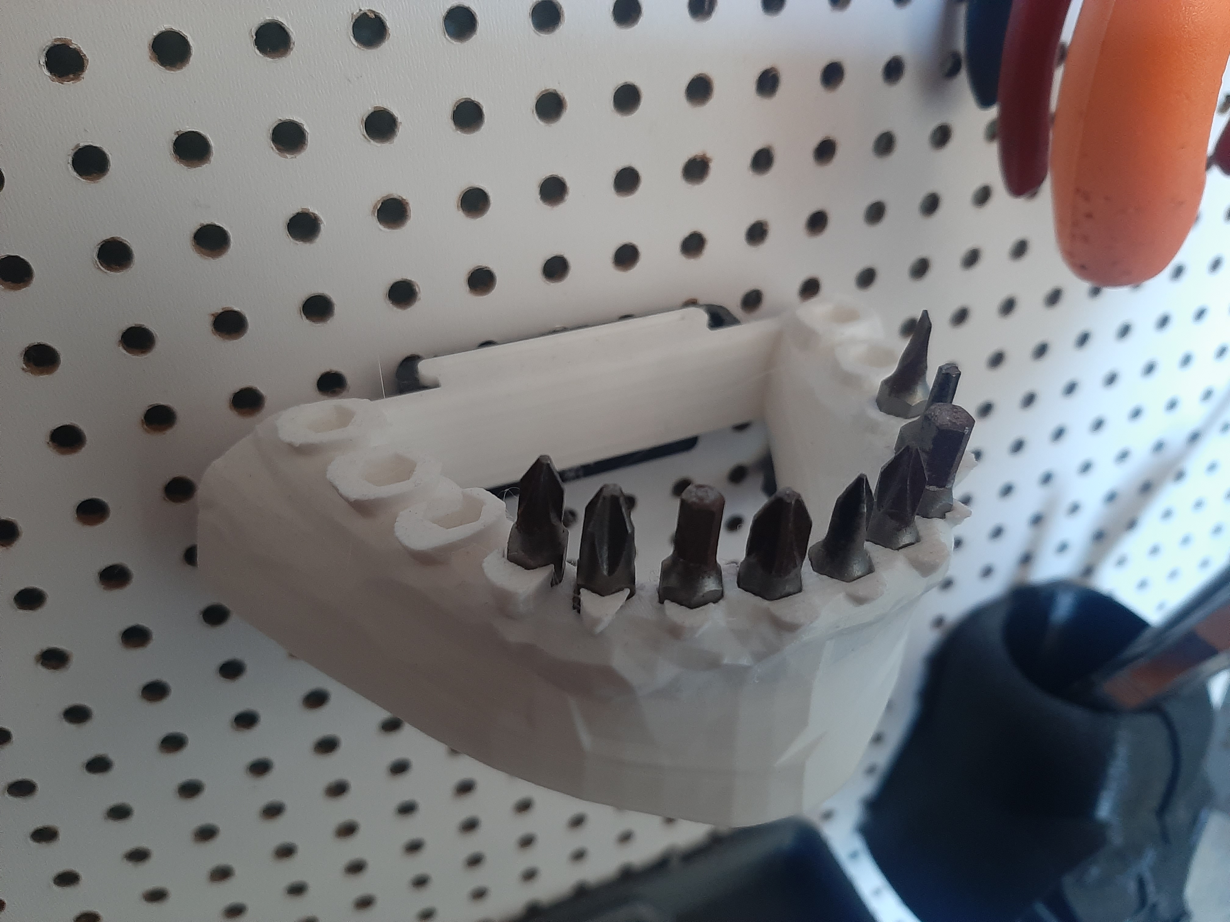 Jaw bit holder for pegboard, easily removable