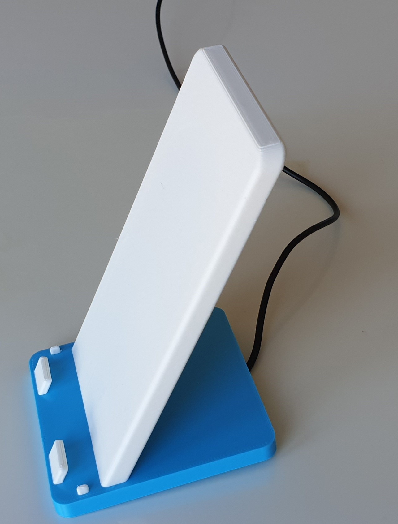Phone stand with bultin wireless charging