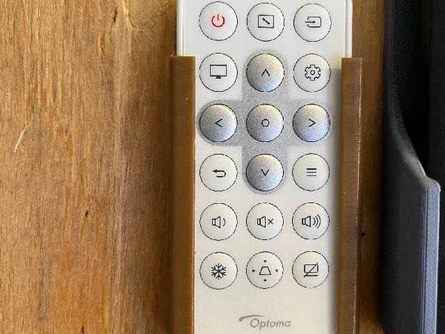 Wall mounted holder for Optoma projector remotes