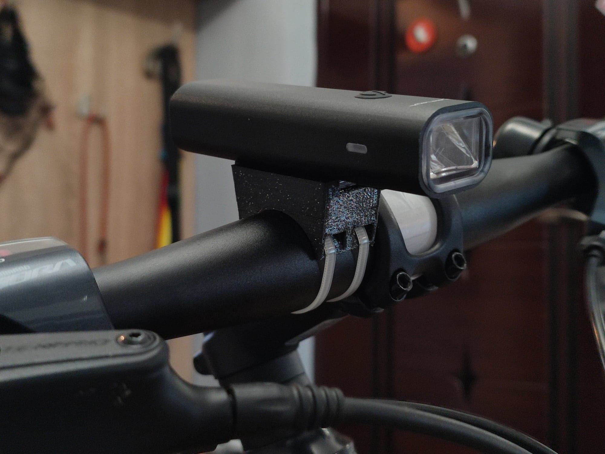Bicycle light handlebar support