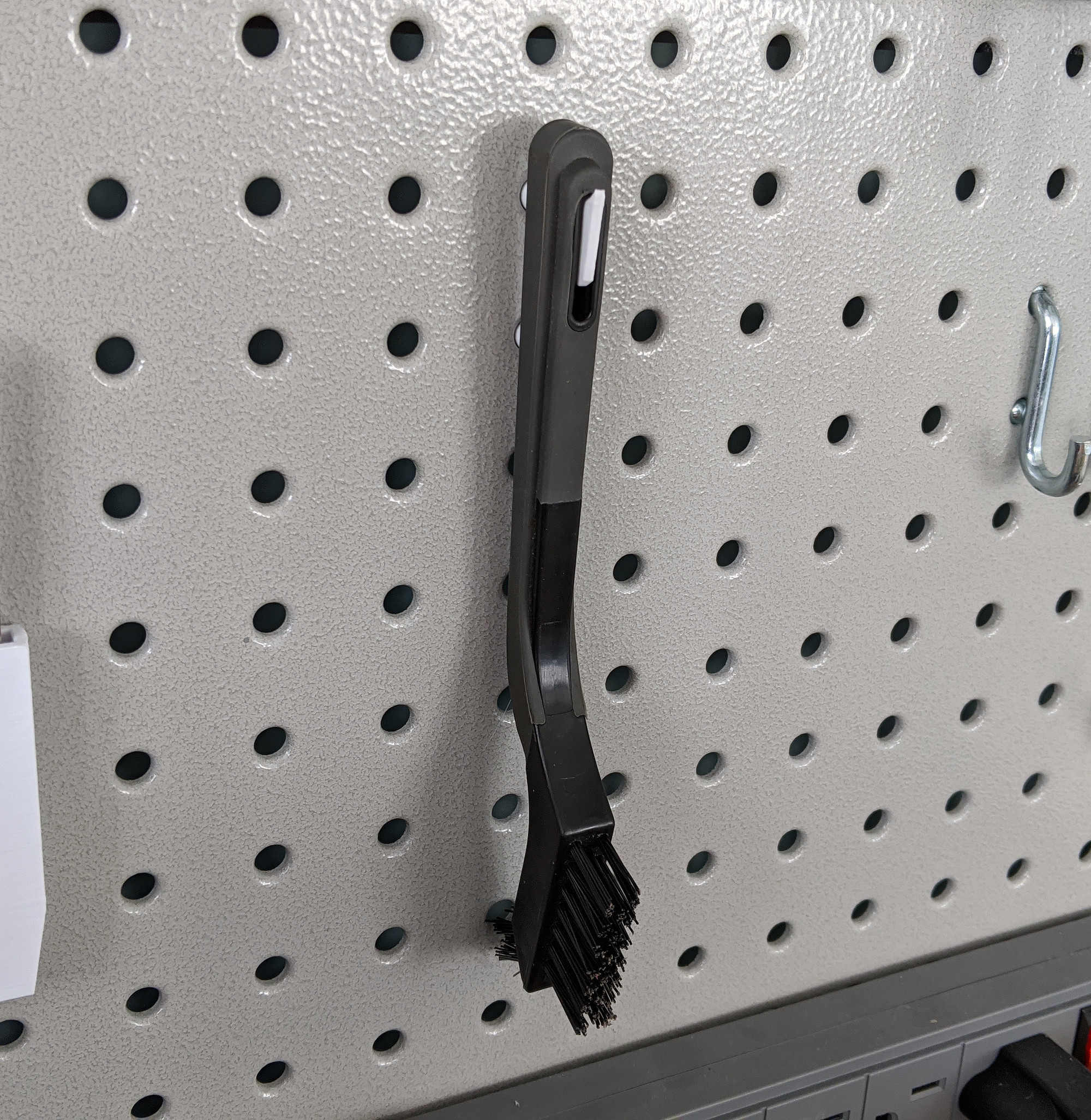 Pegboard wirebrush hanger