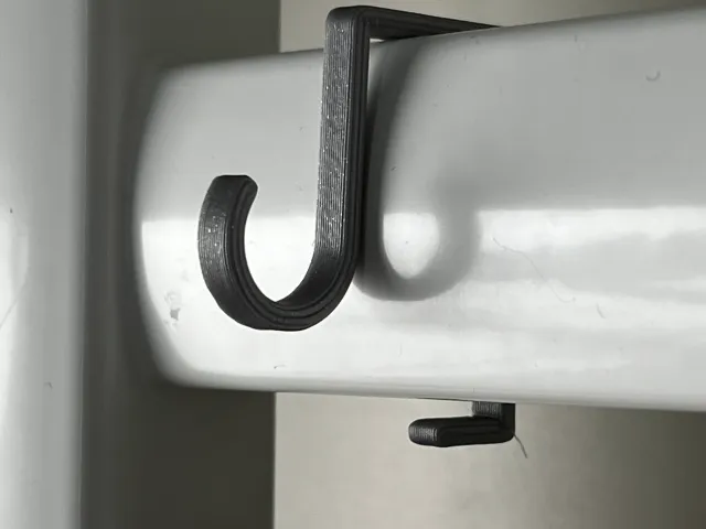 Hook for towel heater radiator