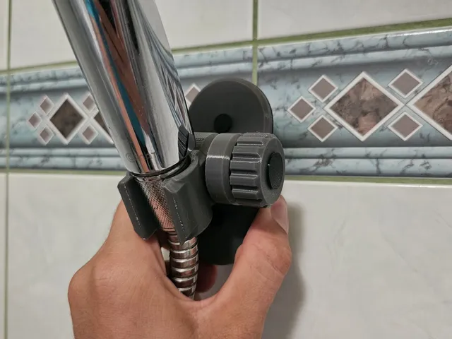 Shower head holder with adjusting wheel
