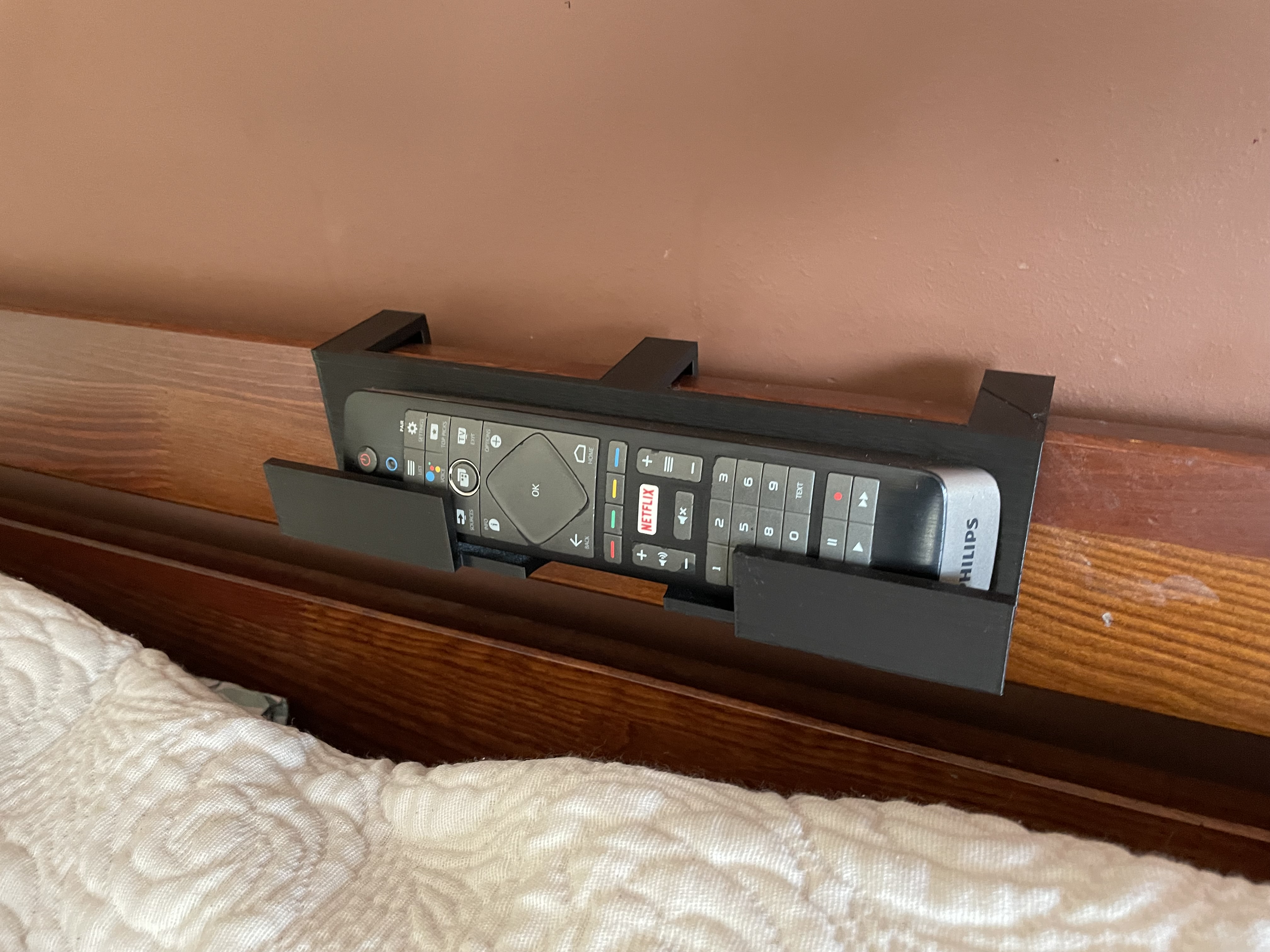 Tv remote bed holder
