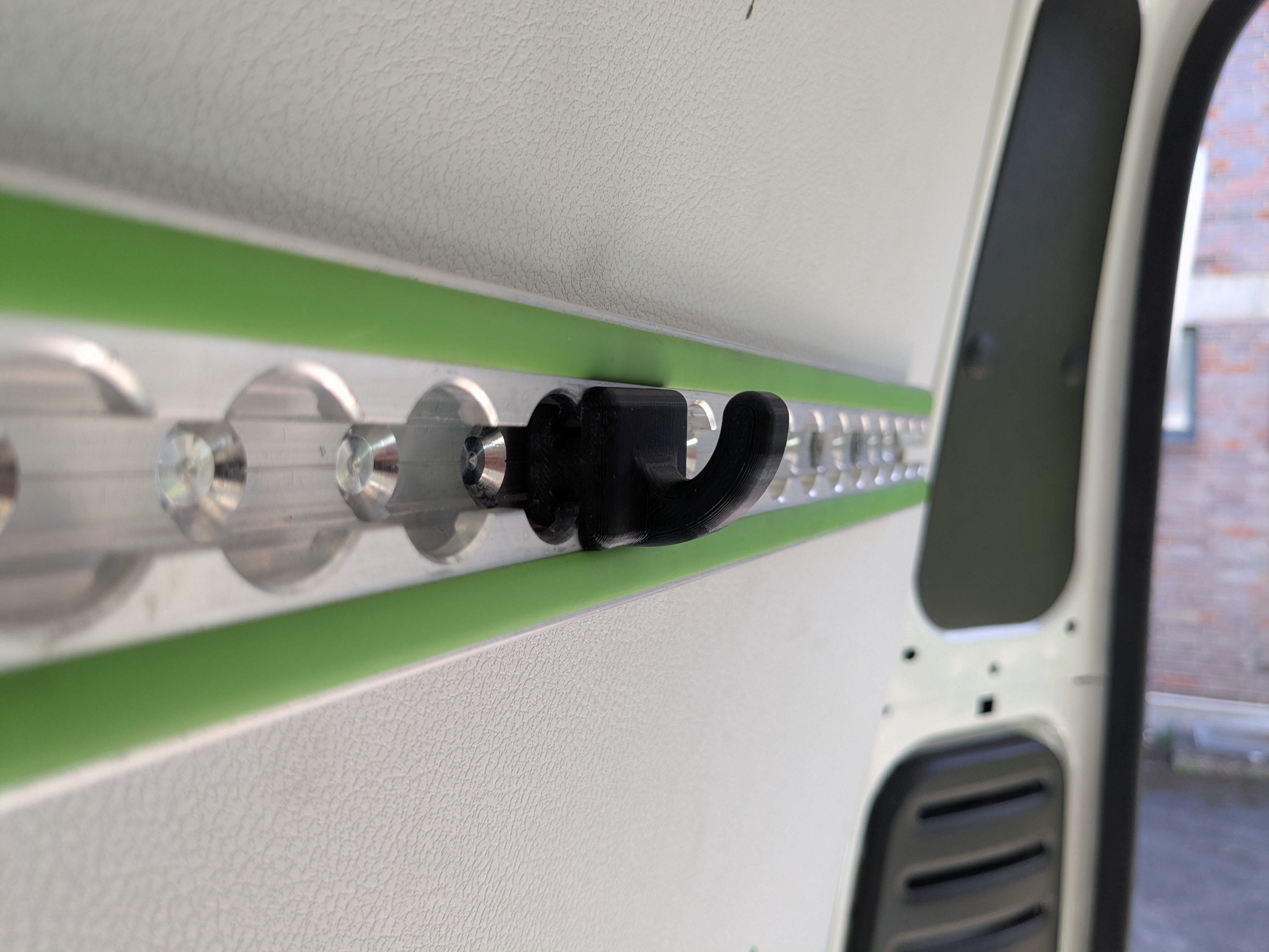 Coat hook for bott load-securing rail