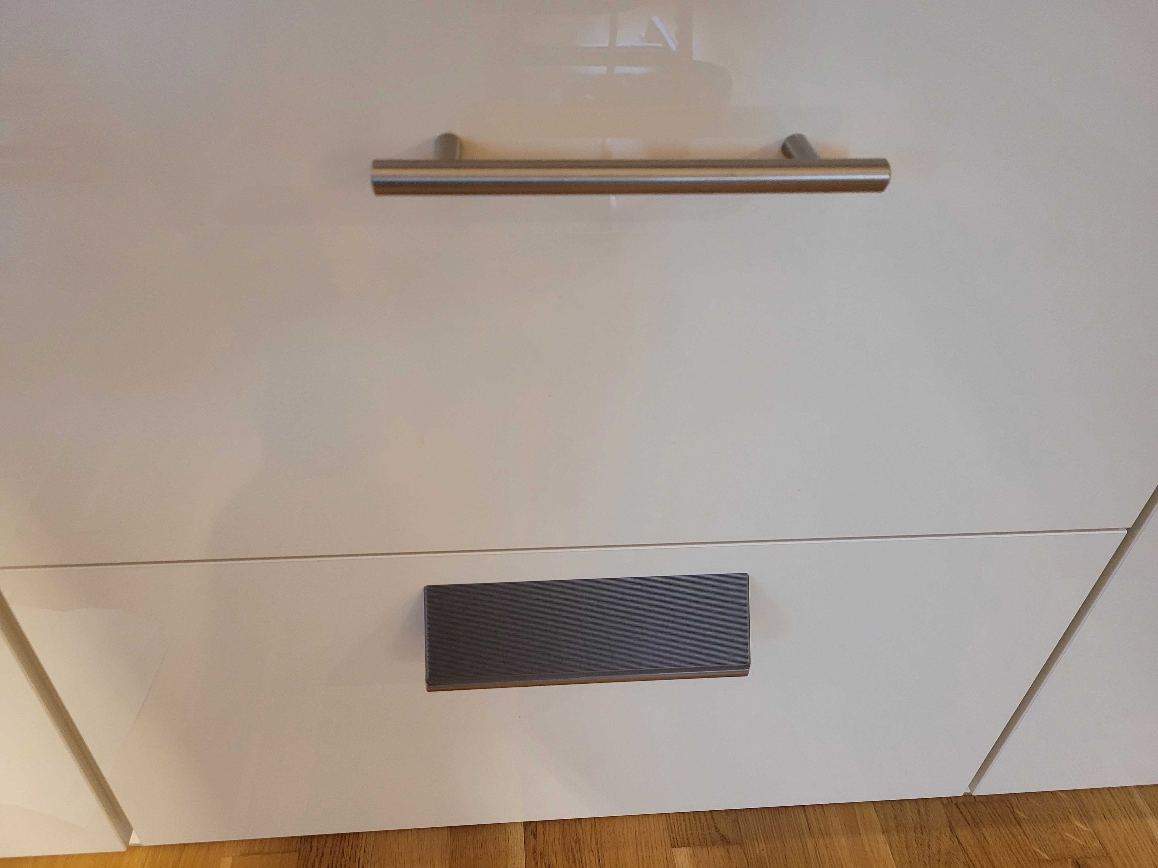 Child proof drawer handles with slopes